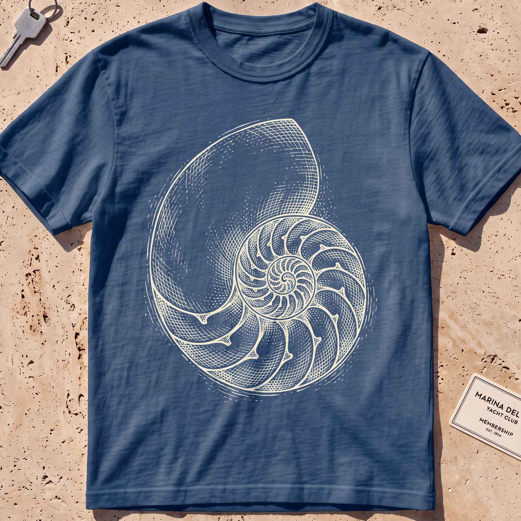 midnight heavyweight tee with an etched nautilus shell graphic.