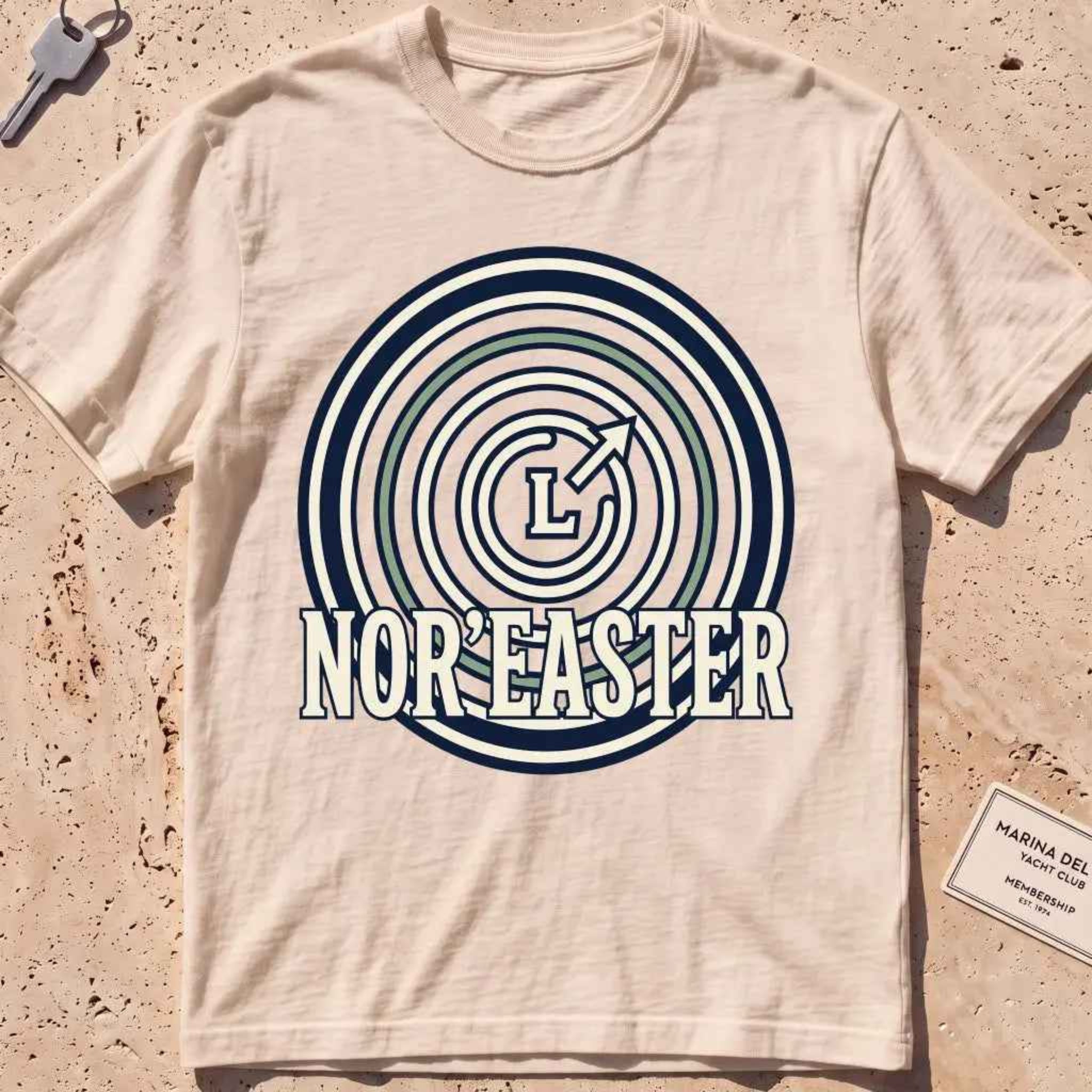 ivory heavyweight tee with an isobar weather-map "Nor'easter" badge.