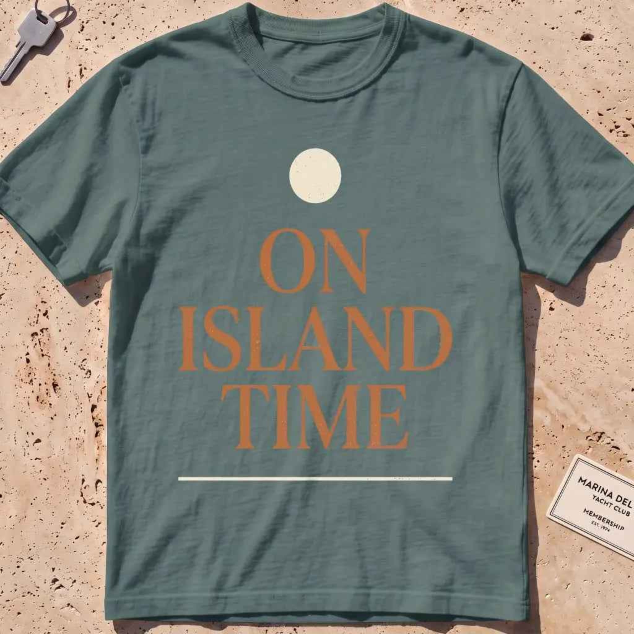 blue spruce heavyweight tee with terracotta "On Island Time" type and sun disc.