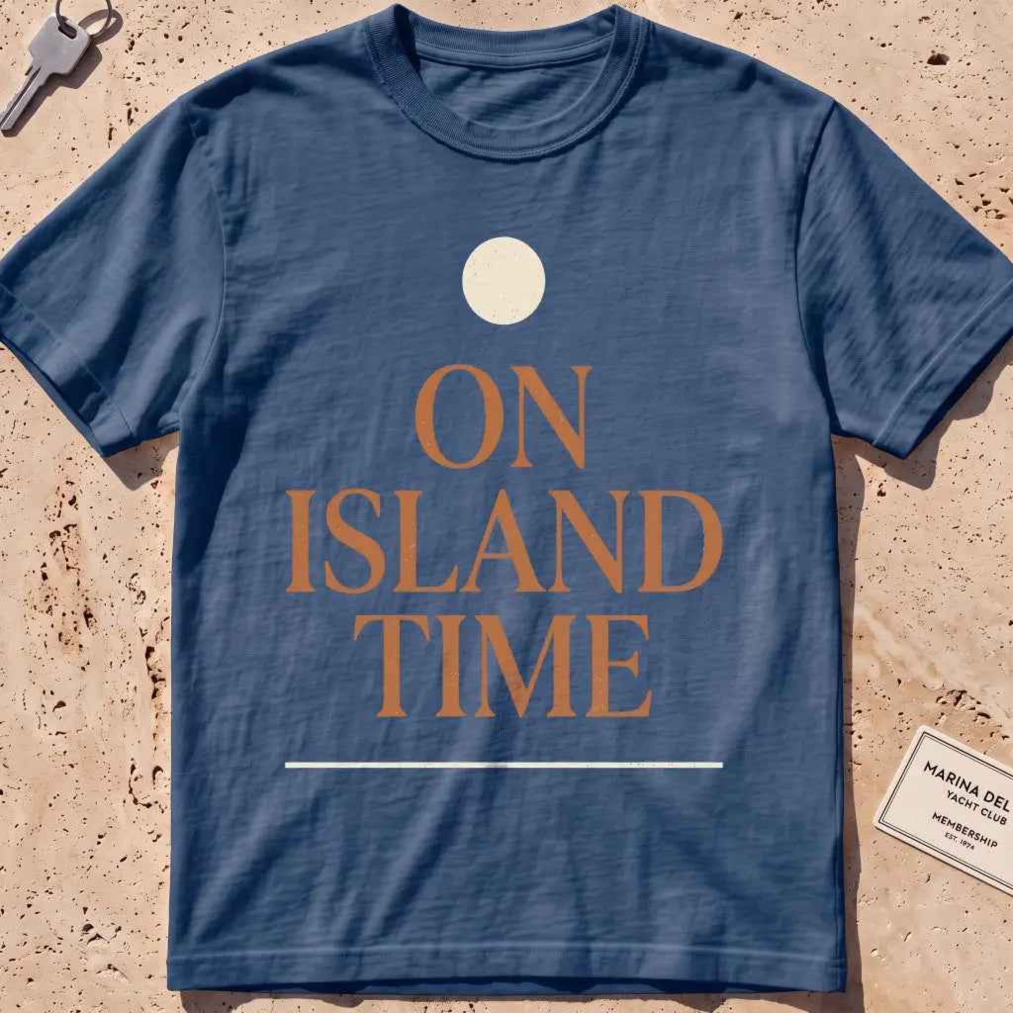 midnight heavyweight tee with terracotta "On Island Time" type and sun disc.