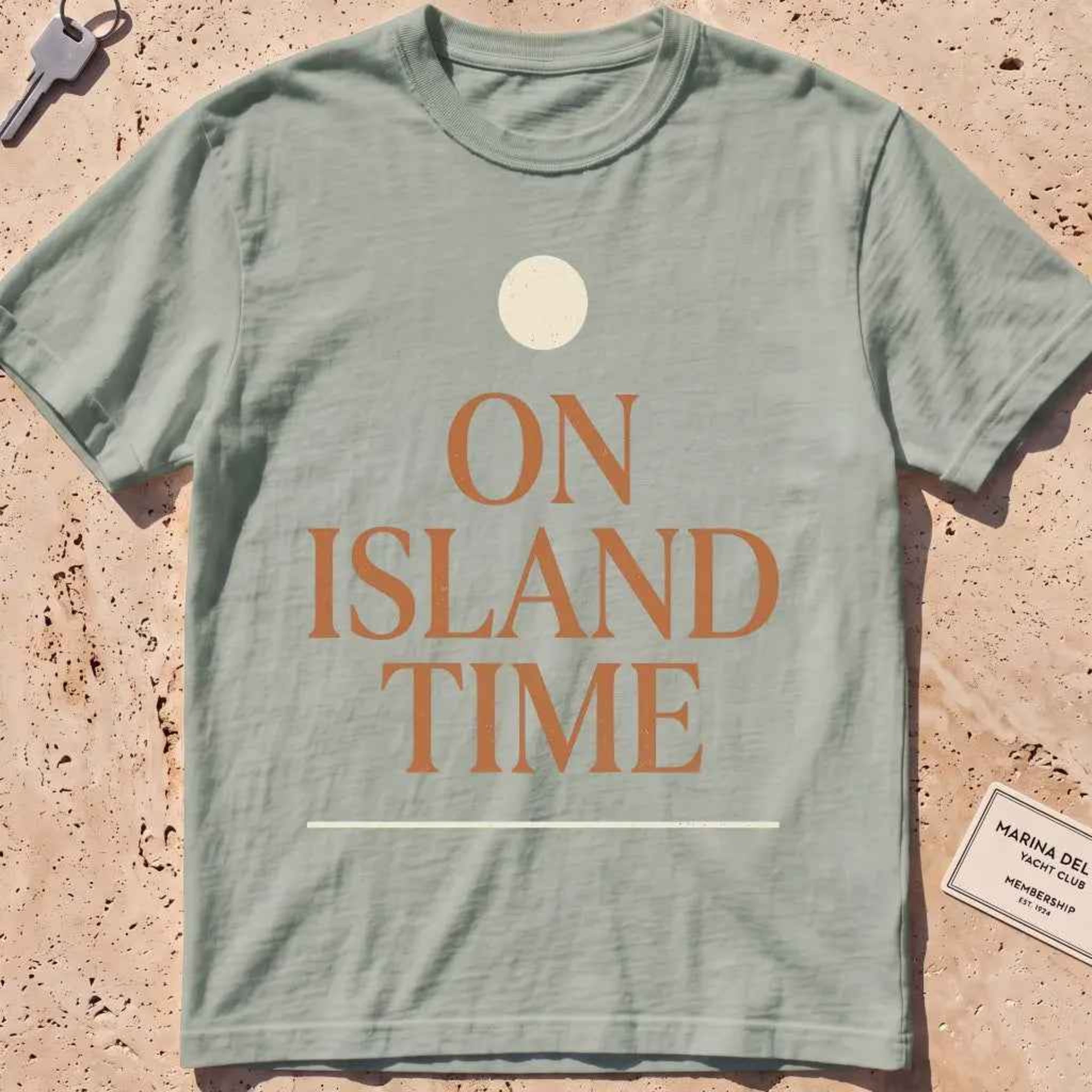bay heavyweight tee with terracotta "On Island Time" type and sun disc.