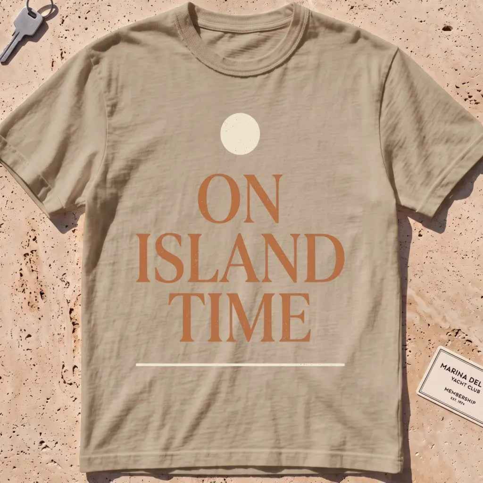 khaki heavyweight tee with terracotta "On Island Time" type and sun disc.