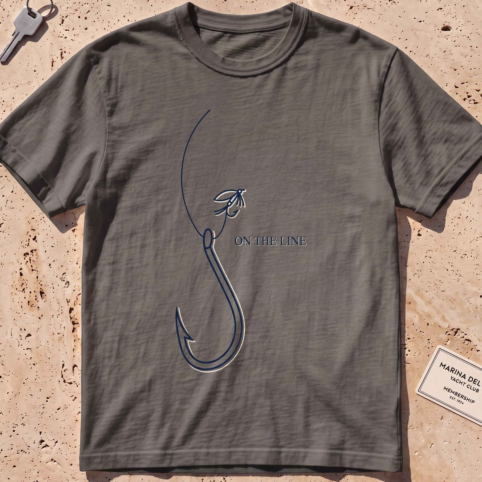 pepper heavyweight tee with a single-line fishing hook and fly graphic.