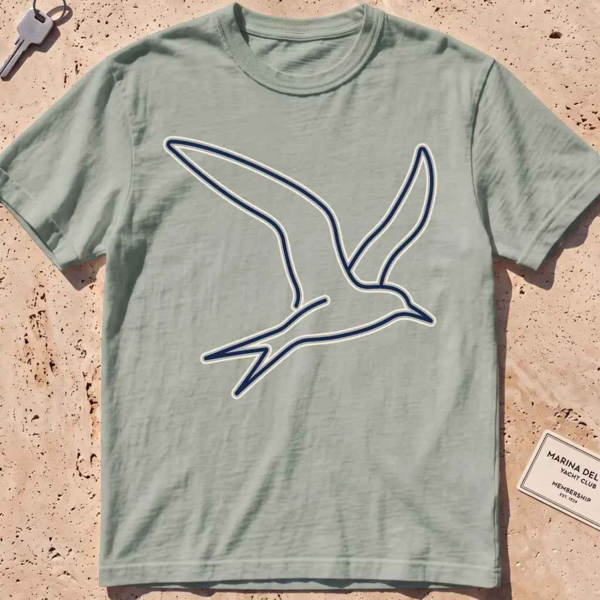 bay heavyweight tee with a wordless continuous-line tern in flight.