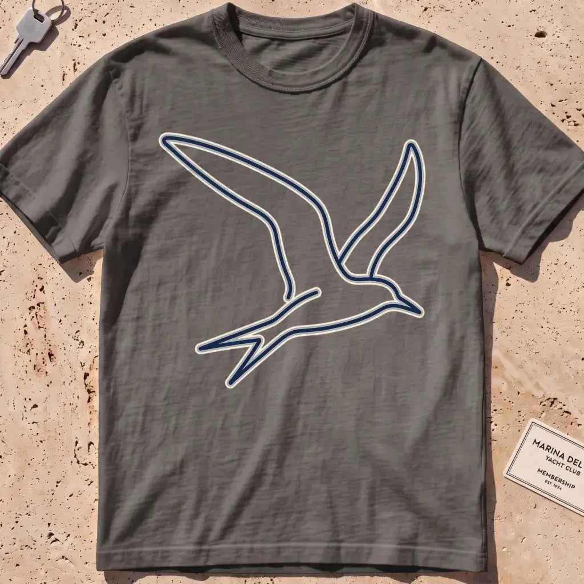 pepper heavyweight tee with a wordless continuous-line tern in flight.
