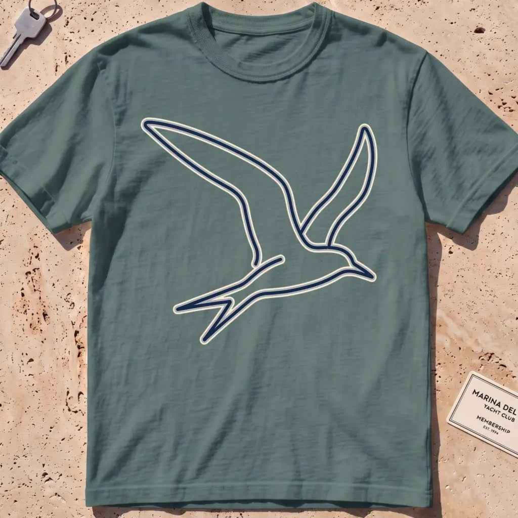 blue spruce heavyweight tee with a wordless continuous-line tern in flight.
