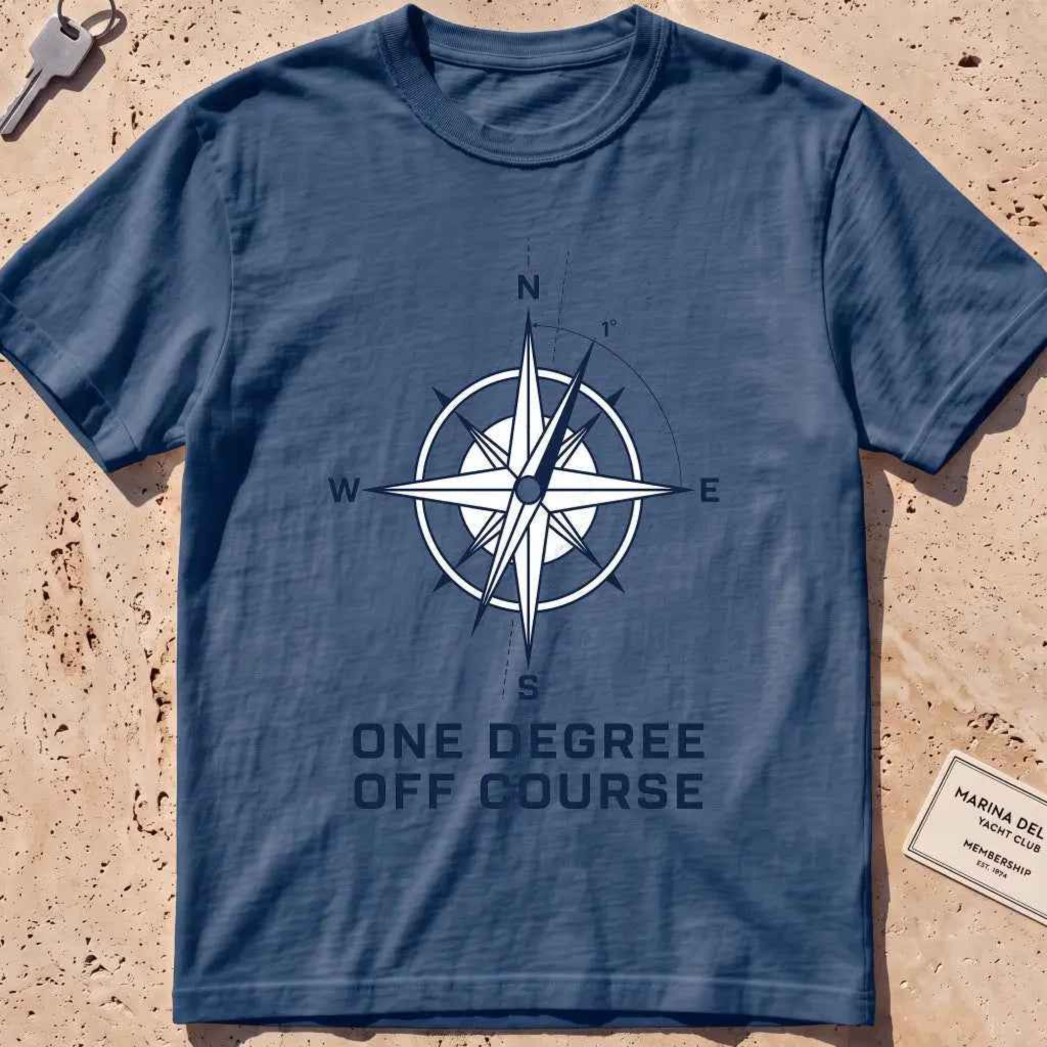 midnight heavyweight tee with a compass rose "One Degree Off Course" graphic.