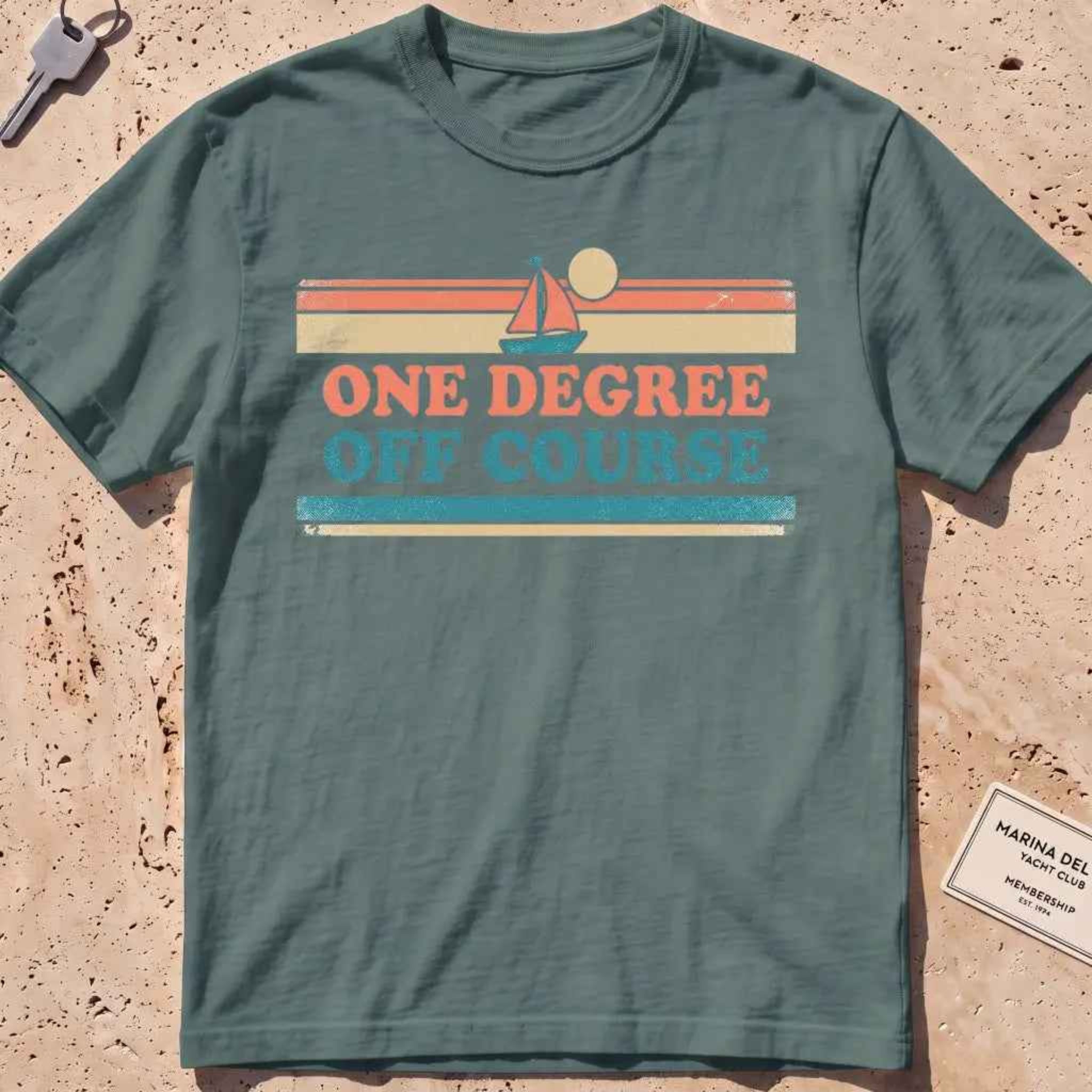 blue spruce heavyweight tee with retro stripes and "One Degree Off Course" text.