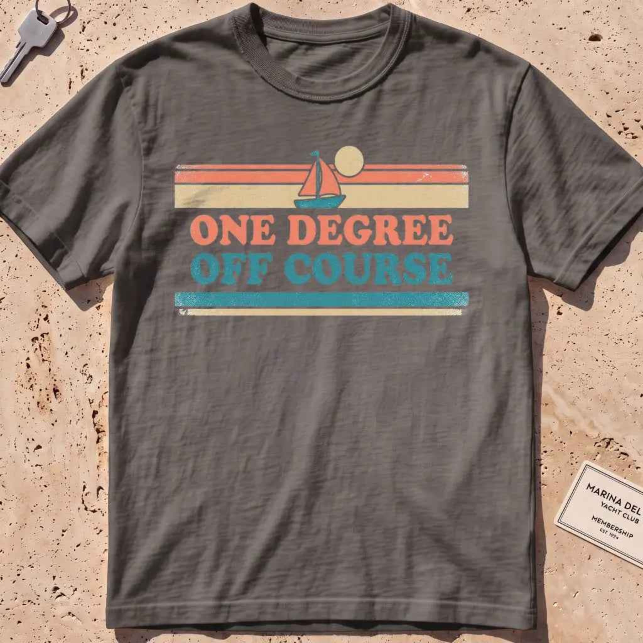 pepper heavyweight tee with retro stripes and "One Degree Off Course" text.