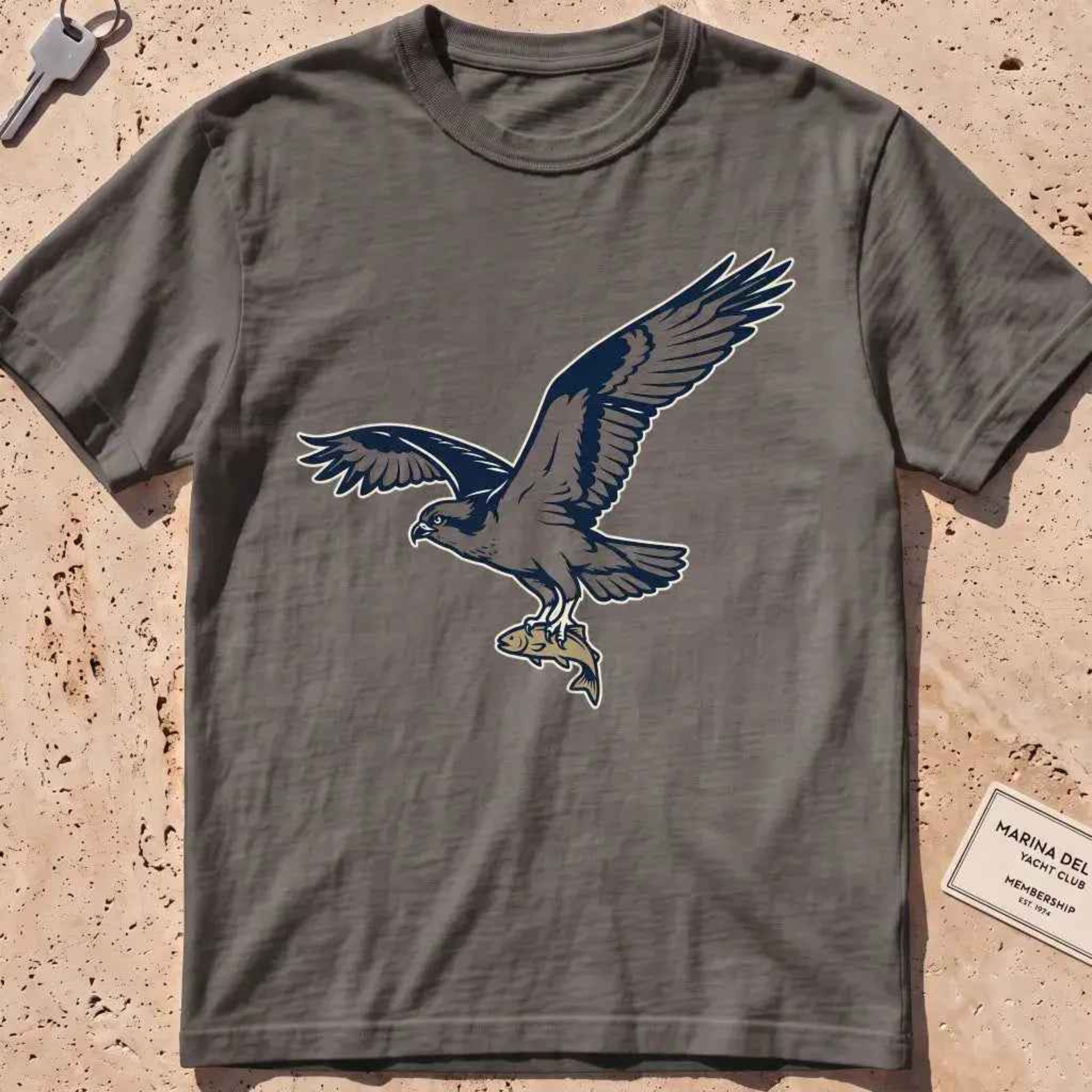 pepper heavyweight tee with a bold-fill osprey carrying a fish in its talons graphic.
