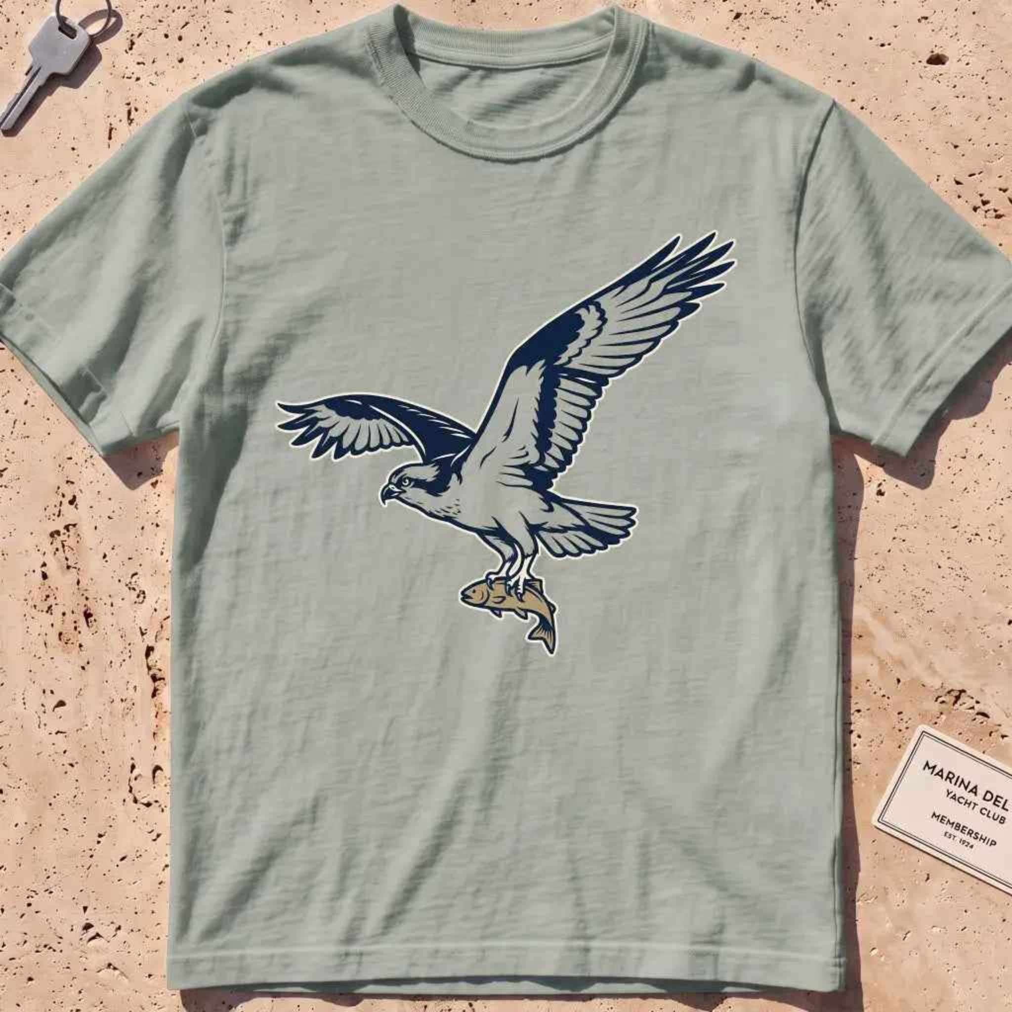 bay heavyweight tee with a bold-fill osprey carrying a fish in its talons graphic.