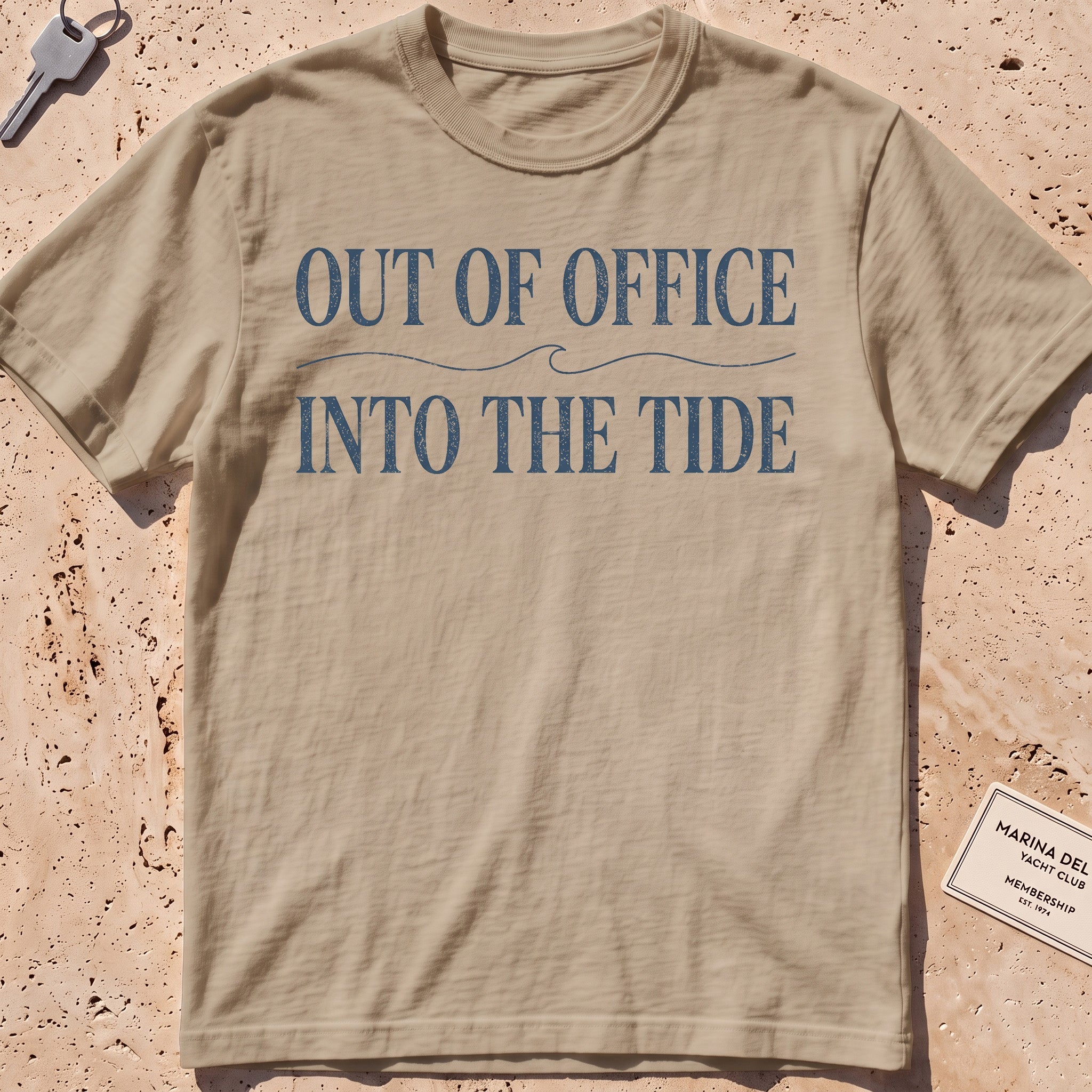 khaki heavyweight tee with "Out of Office Into the Tide" type over a wave.