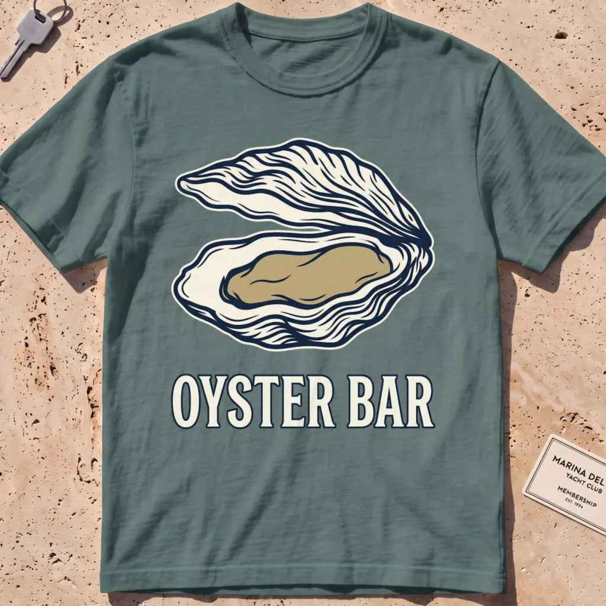 blue spruce heavyweight tee with a finely engraved oyster shell in vintage line style.