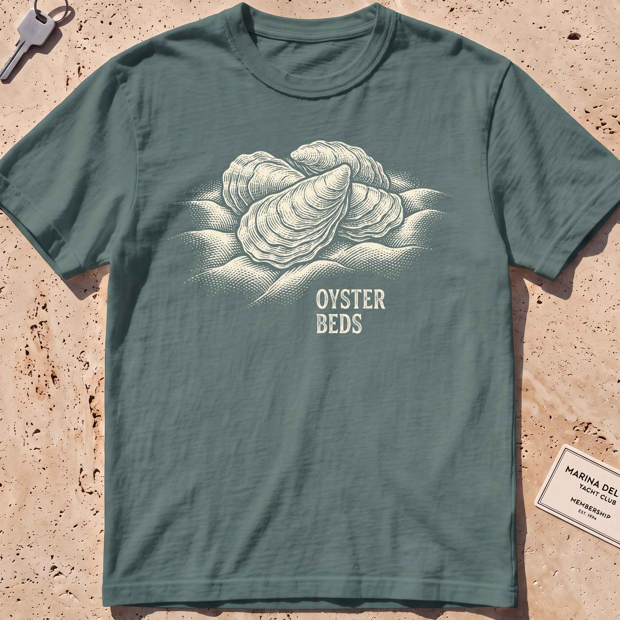 blue spruce heavyweight tee with an etched cluster of oysters graphic.