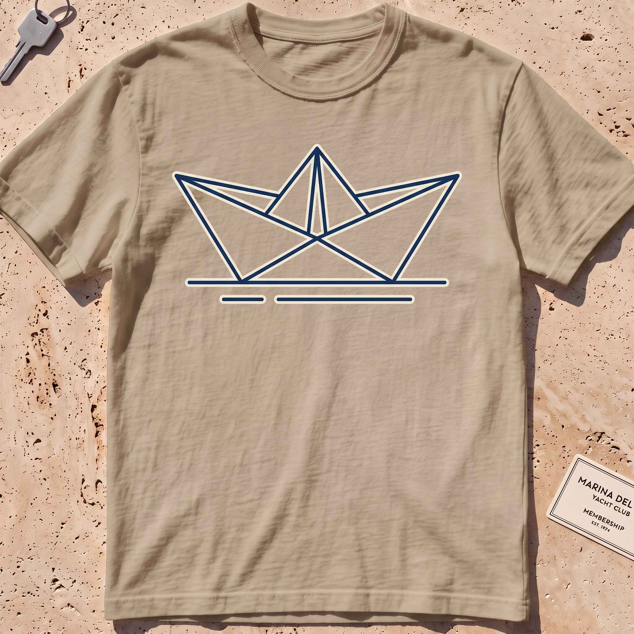 khaki heavyweight tee with a minimalist folded paper-boat graphic.