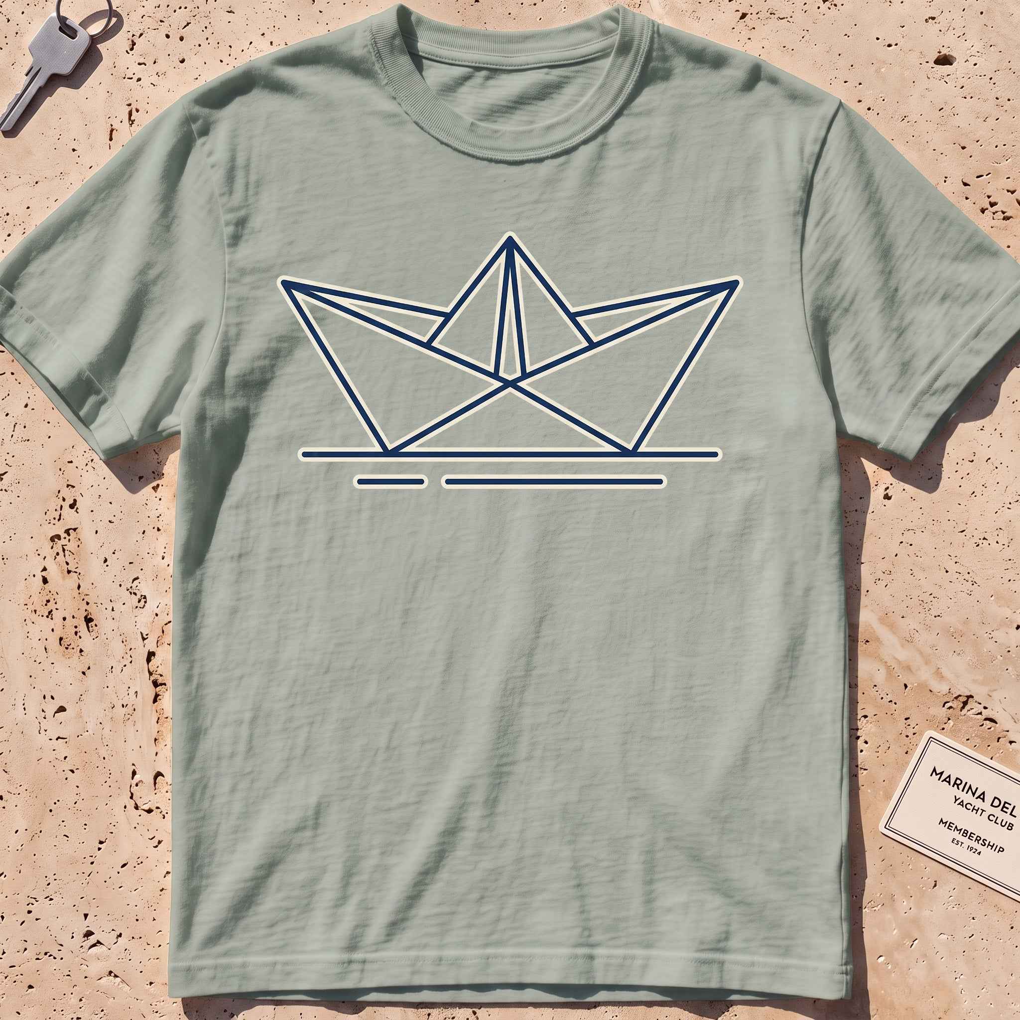 bay heavyweight tee with a minimalist folded paper-boat graphic.