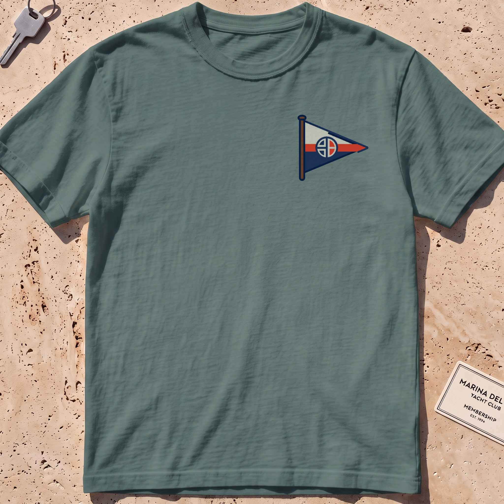 blue spruce heavyweight tee with a sailing burgee pennant crest graphic.
