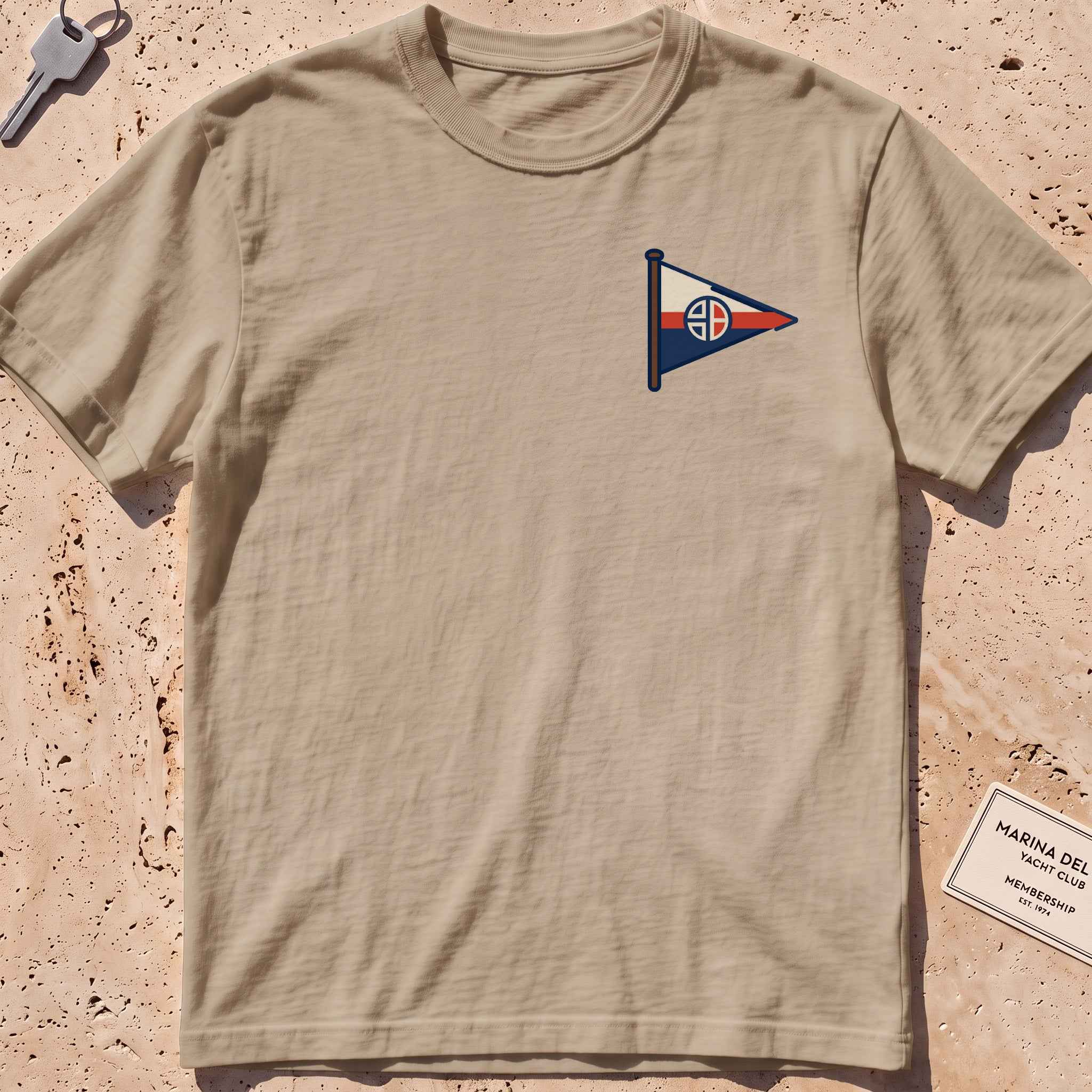 khaki heavyweight tee with a sailing burgee pennant crest graphic.