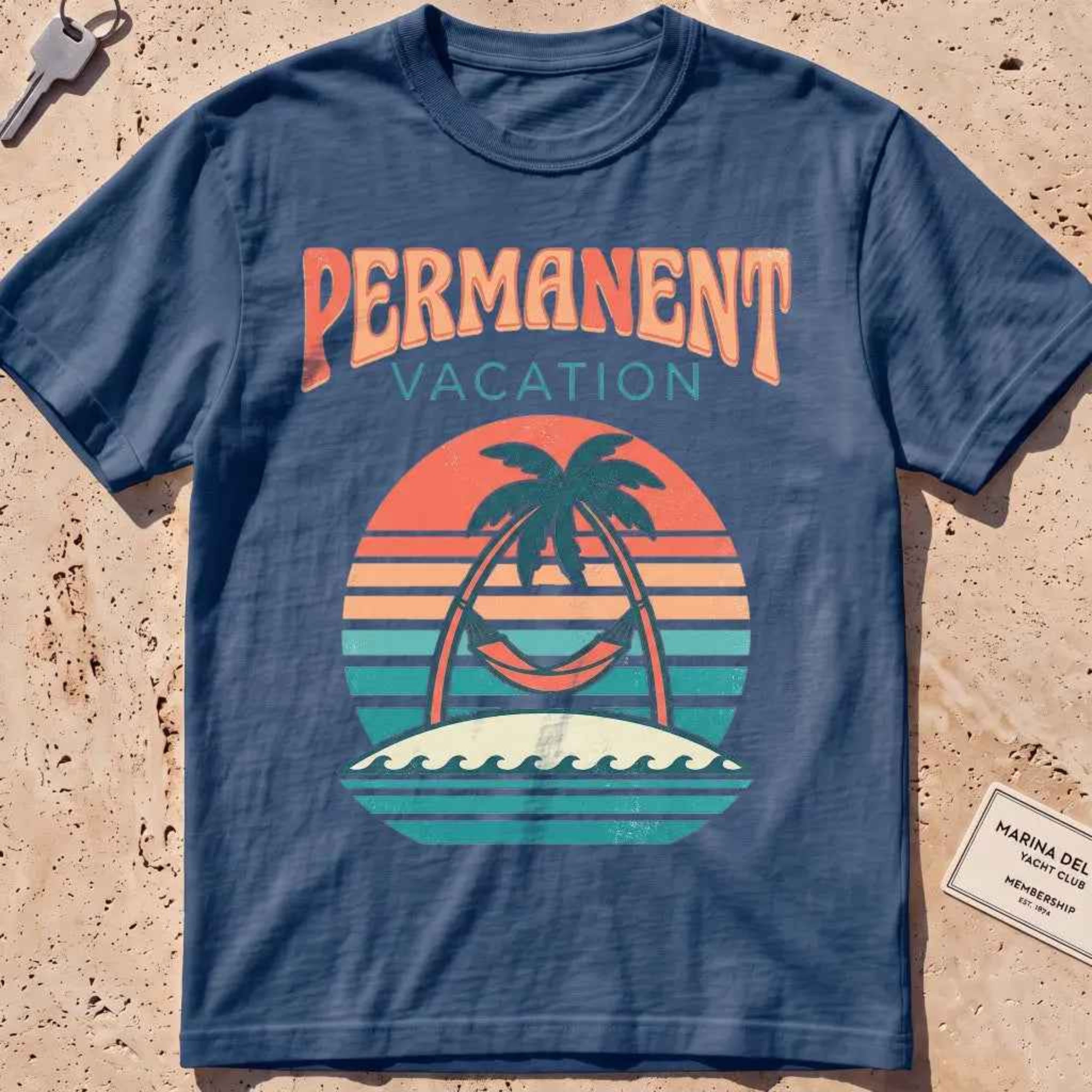 midnight heavyweight tee with a retro sunset and hammock "Permanent Vacation" graphic.