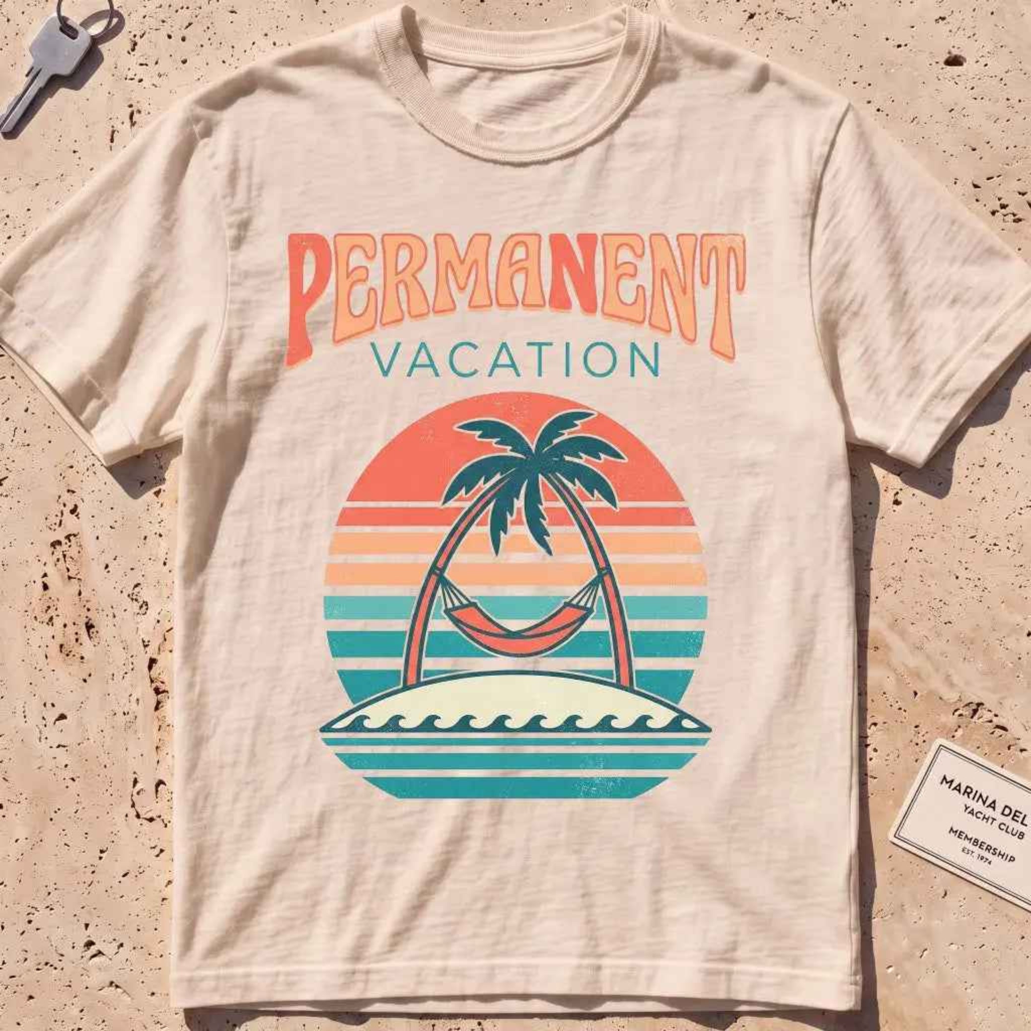ivory heavyweight tee with a retro sunset and hammock "Permanent Vacation" graphic.