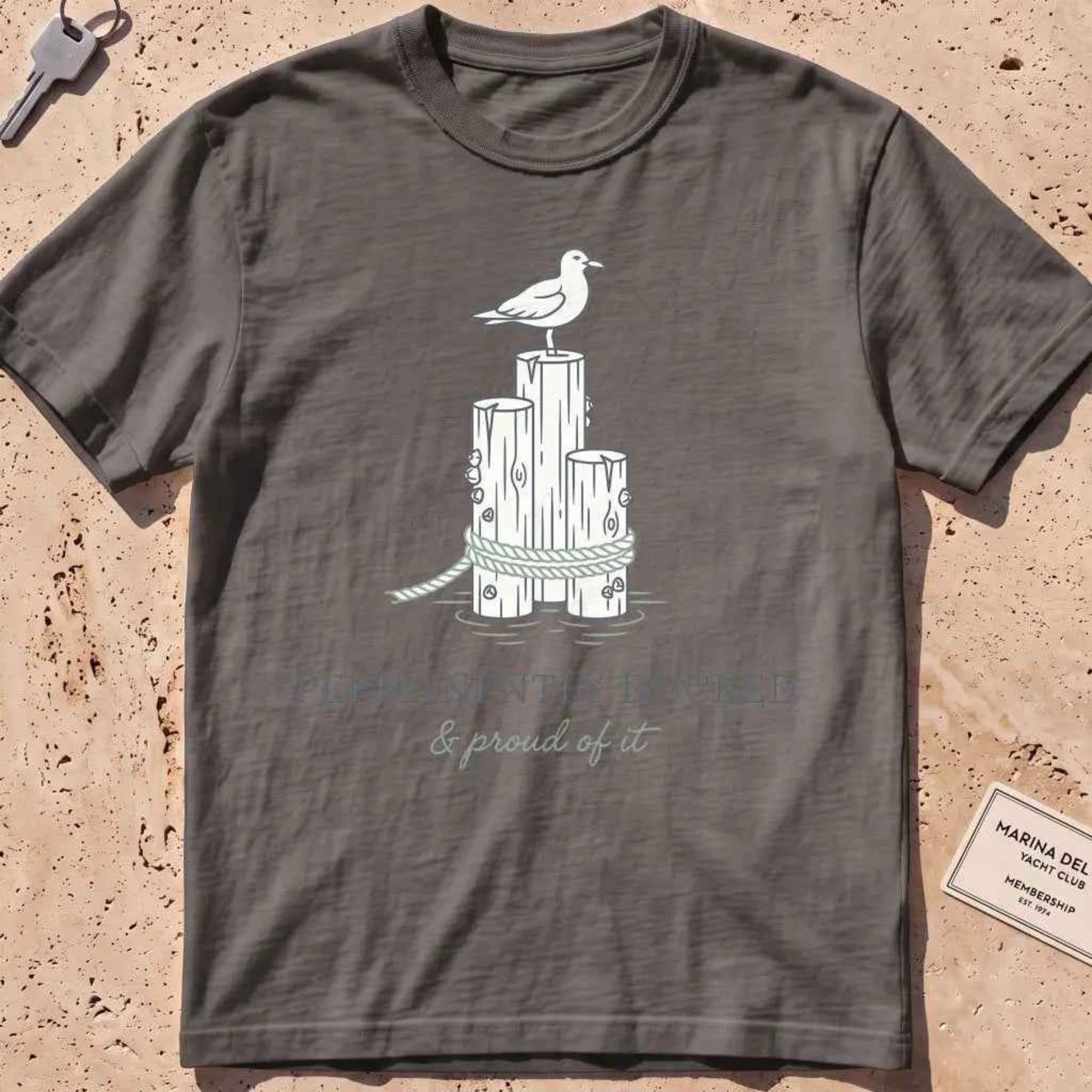 pepper heavyweight tee with dock pilings, a gull and "Permanently Docked" text.