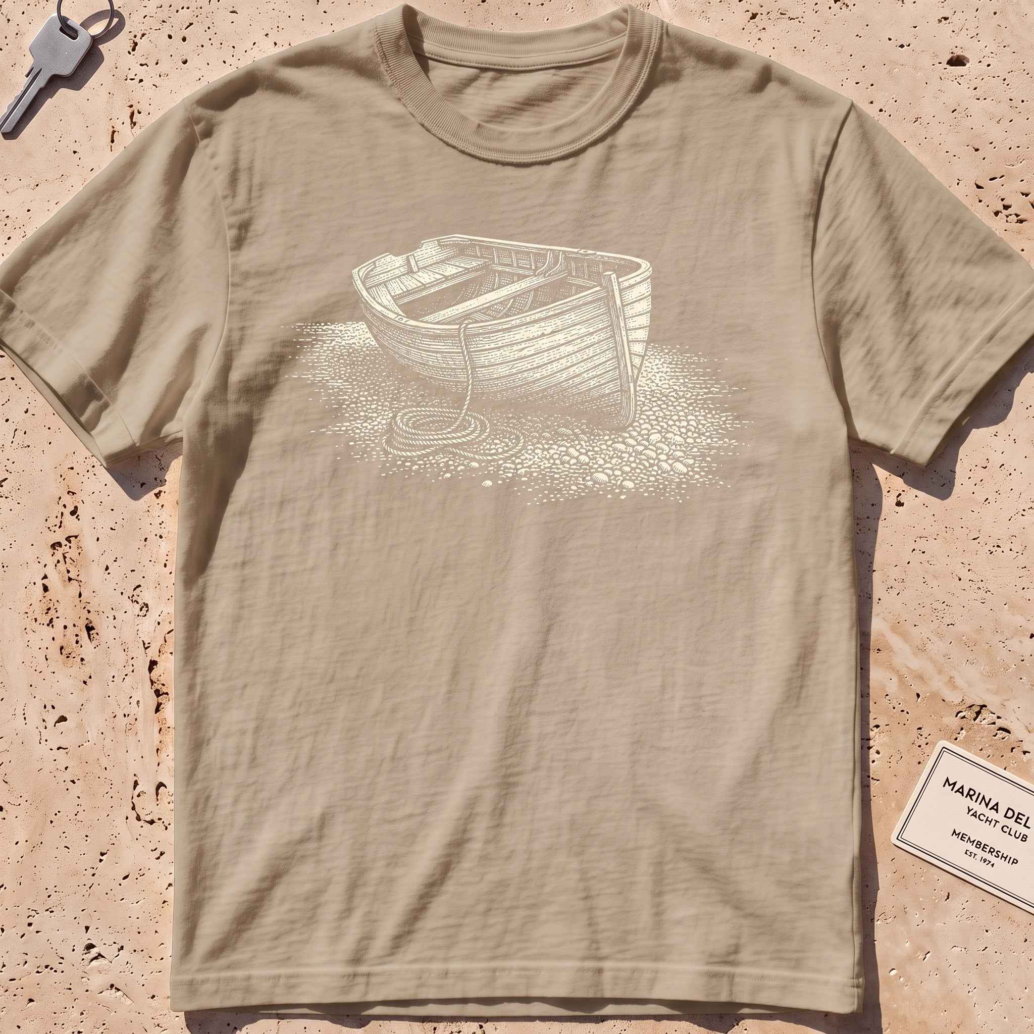 khaki heavyweight tee with an etched dinghy pulled ashore graphic