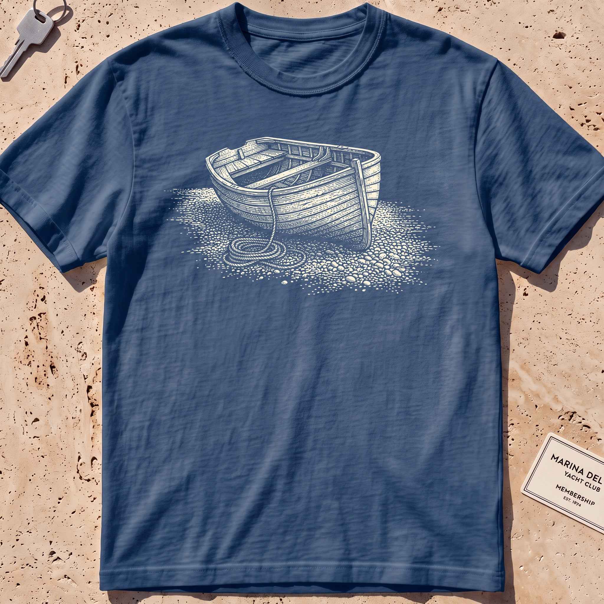 midnight heavyweight tee with an etched dinghy pulled ashore graphic
