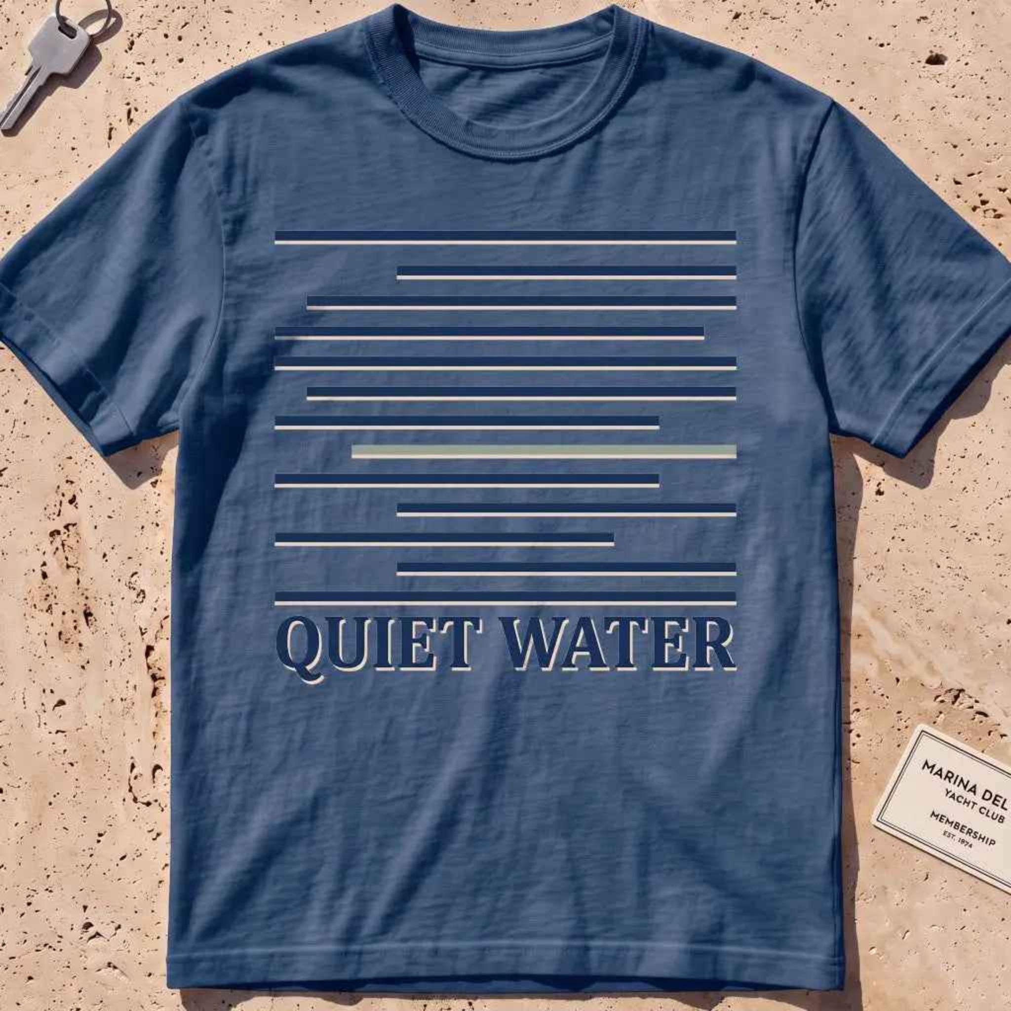 midnight heavyweight tee with still-water lines and "Quiet Water" type.