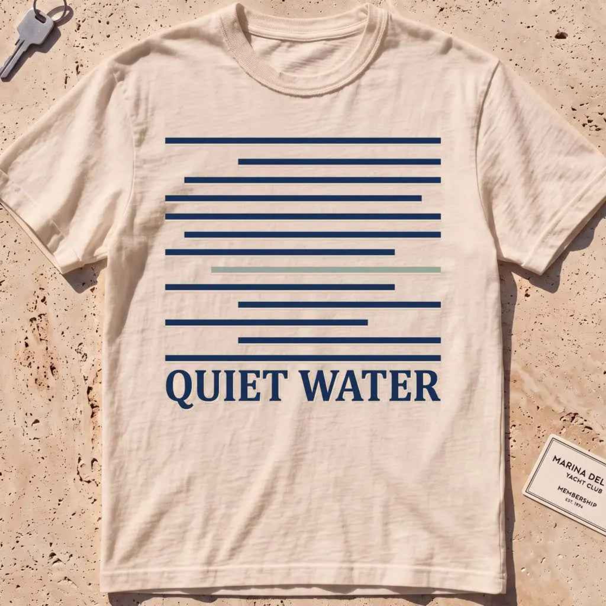 ivory heavyweight tee with still-water lines and "Quiet Water" type.