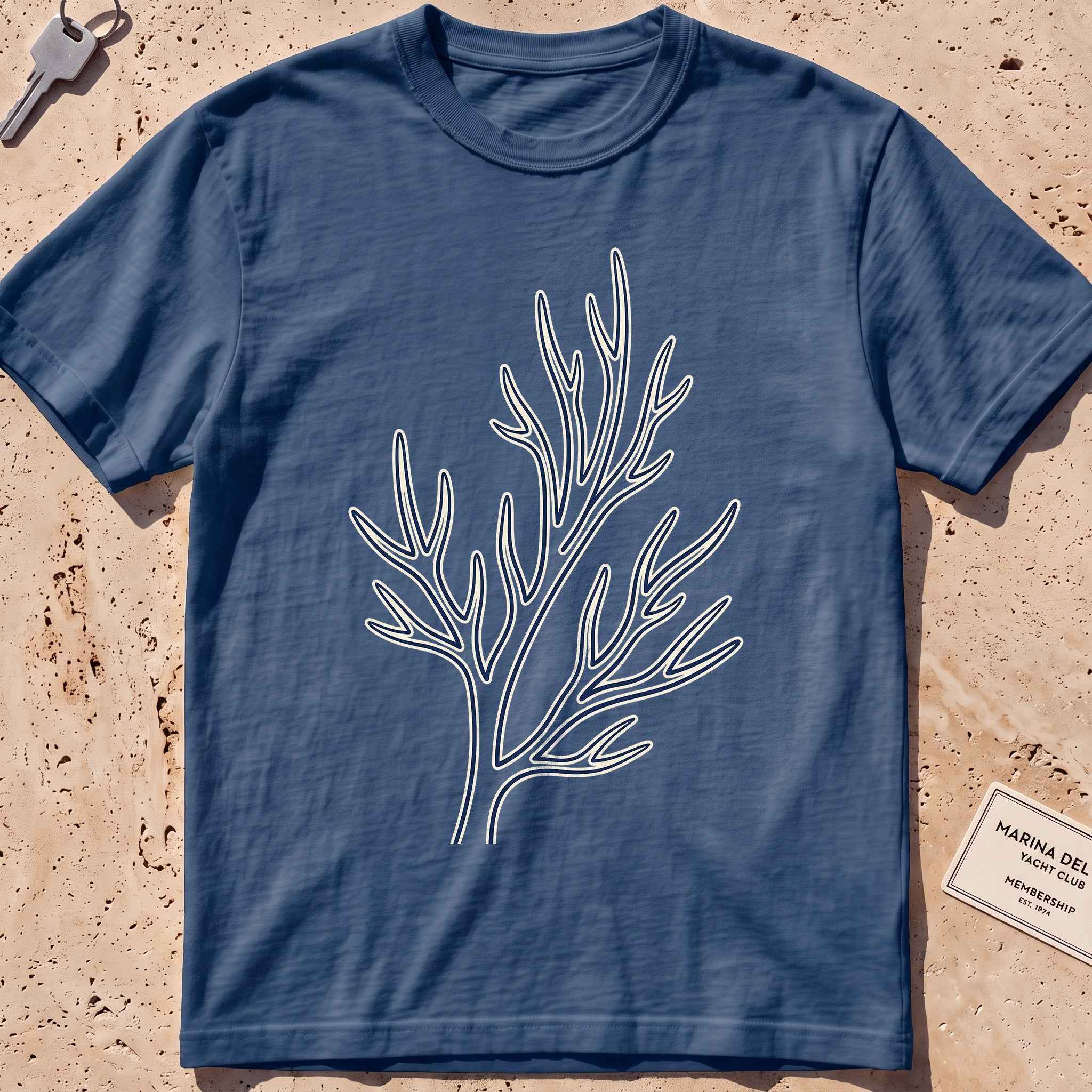 midnight heavyweight tee with a single-line coral branch graphic.
