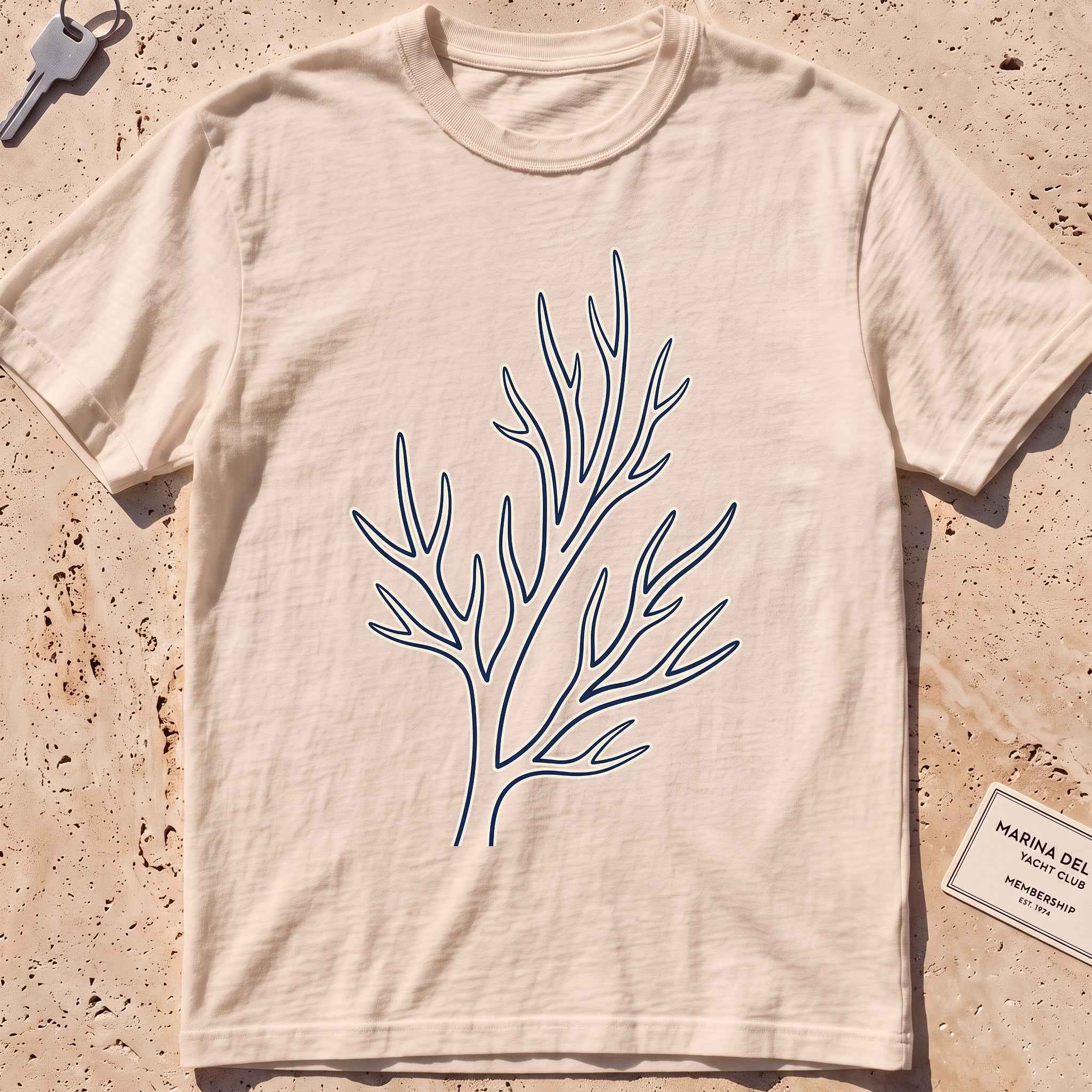 ivory heavyweight tee with a single-line coral branch graphic.
