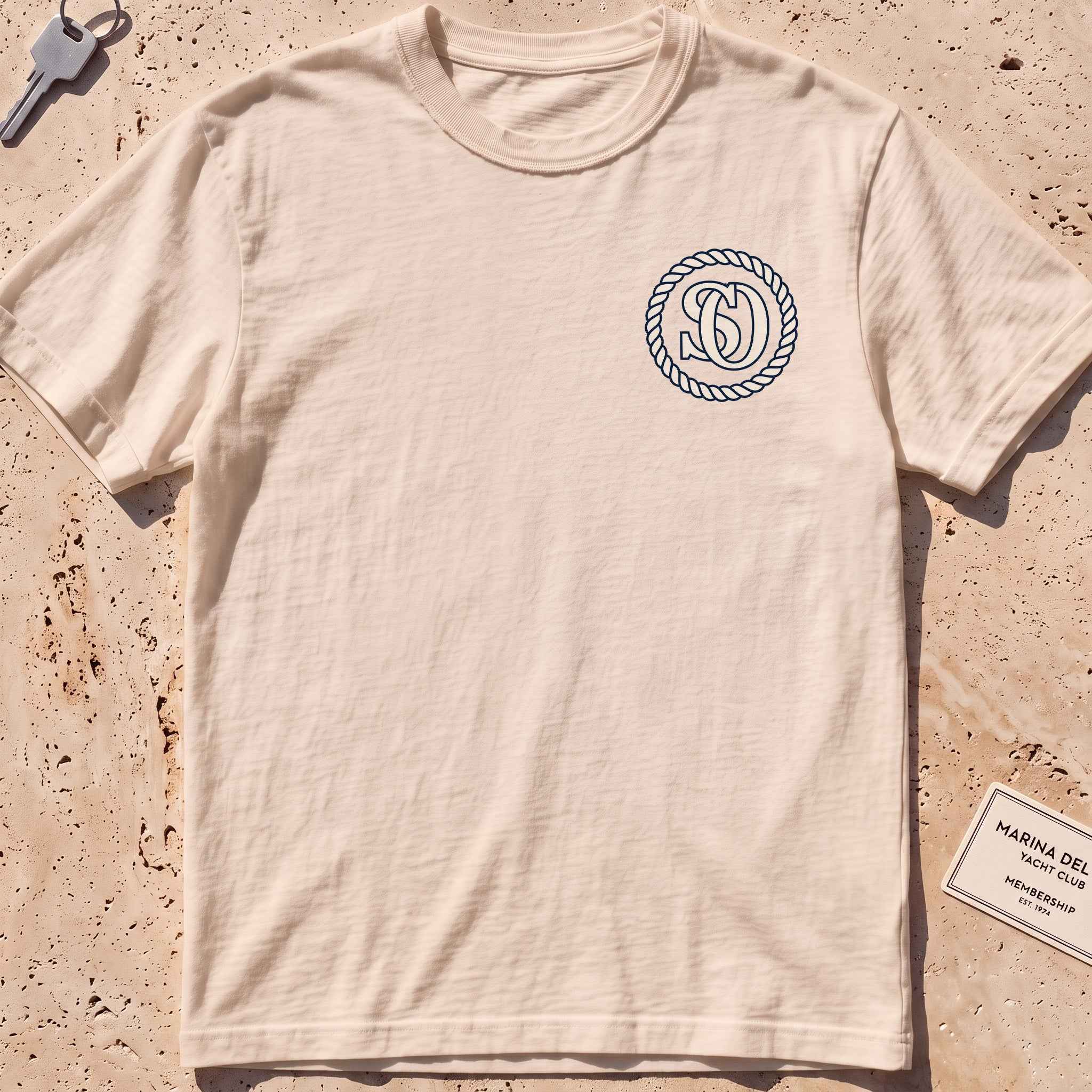 ivory heavyweight tee with a rope-ring SO monogram crest graphic.