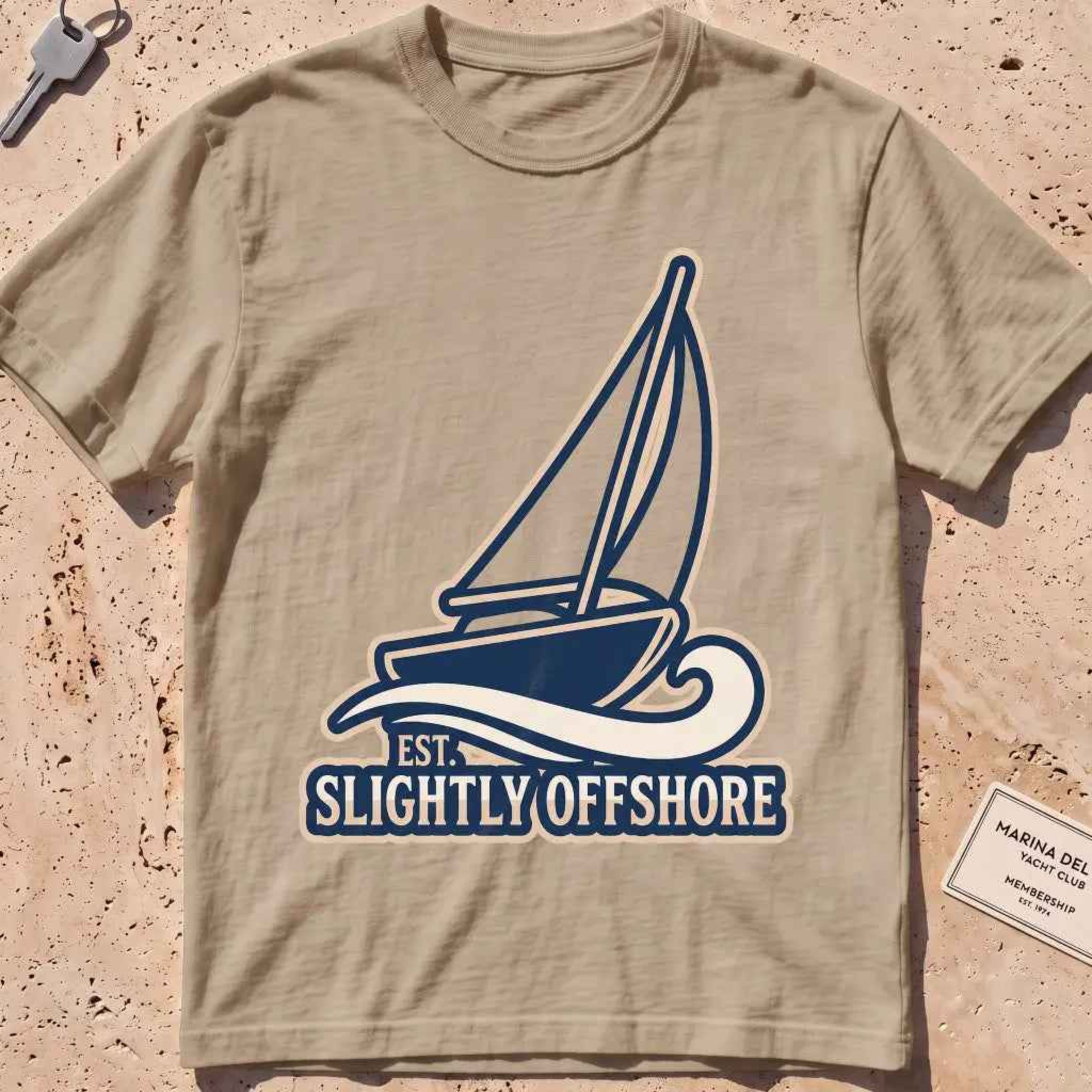 khaki heavyweight tee with a sailboat heeling into the wind, "Sail Away" graphic.