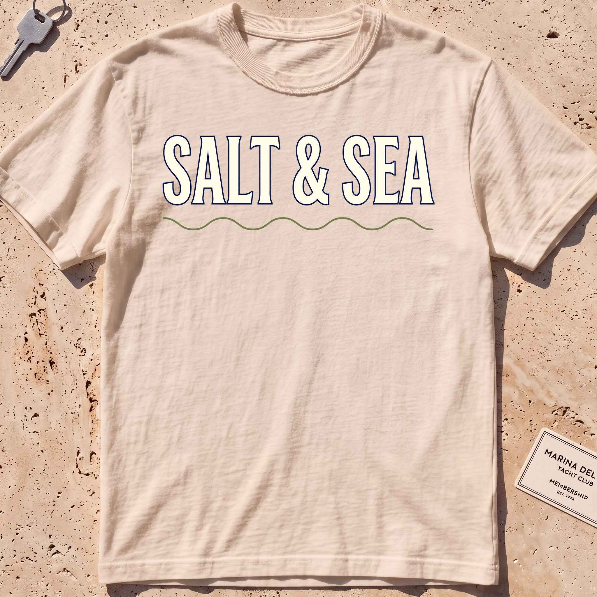 ivory heavyweight tee with bold "Salt & Sea" type graphic.