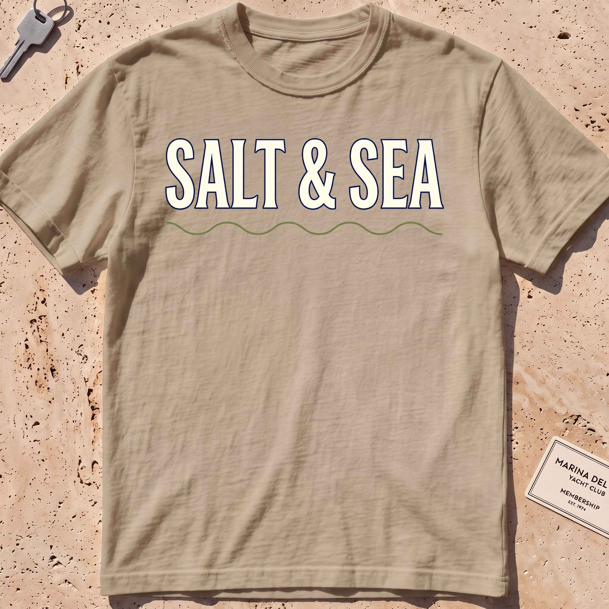 khaki heavyweight tee with bold "Salt & Sea" type graphic.