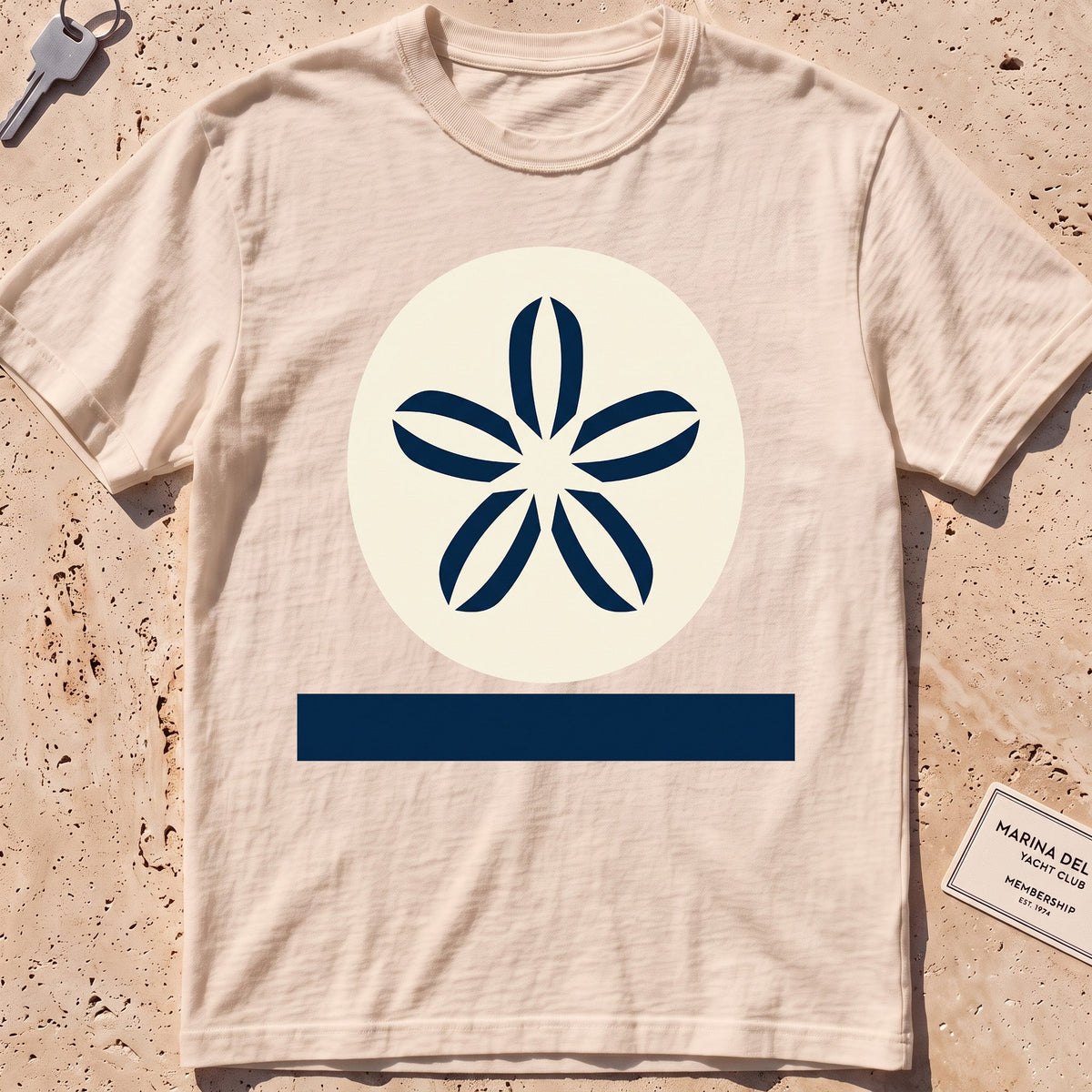 ivory heavyweight tee with a flat-geometric sand dollar graphic.