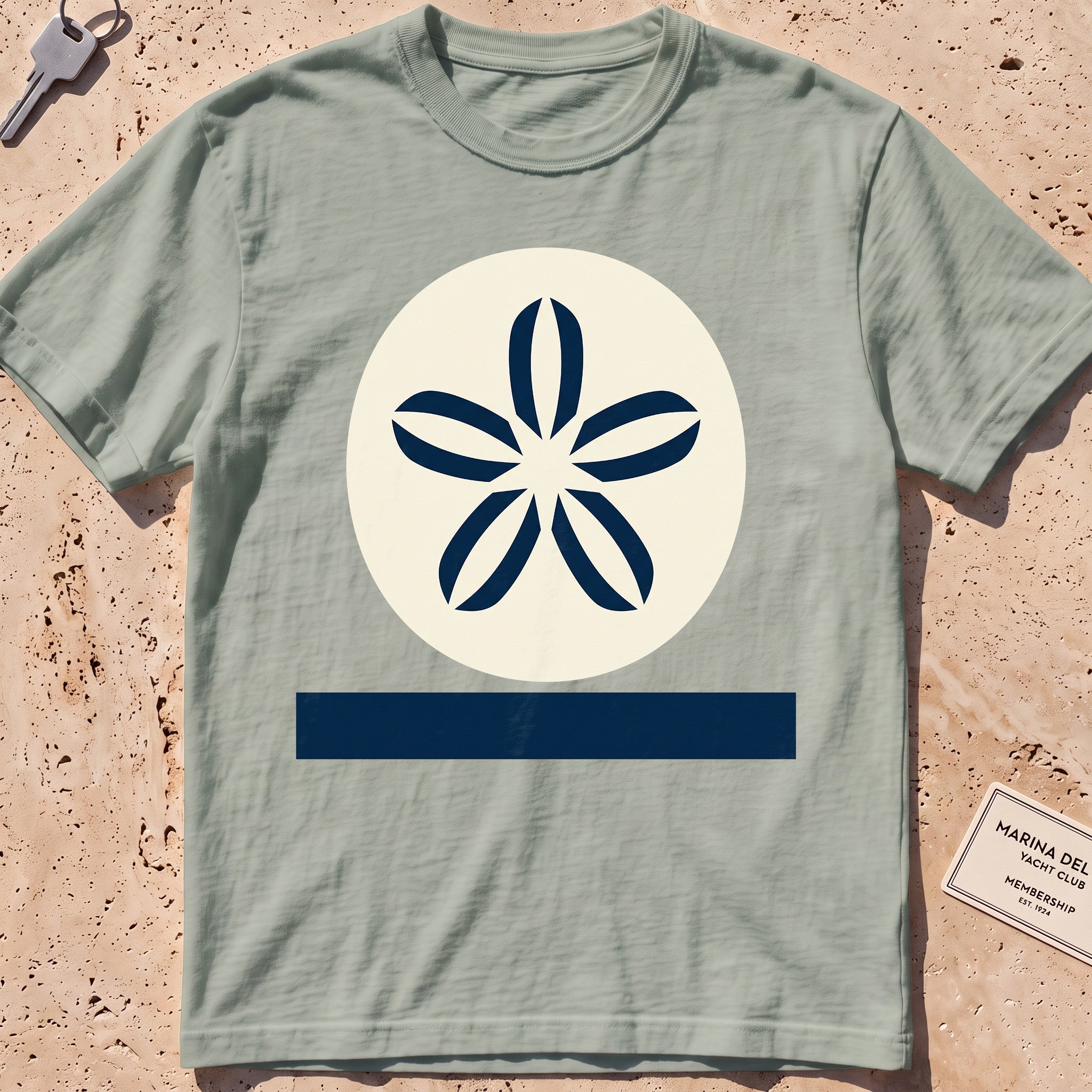 bay heavyweight tee with a flat-geometric sand dollar graphic.