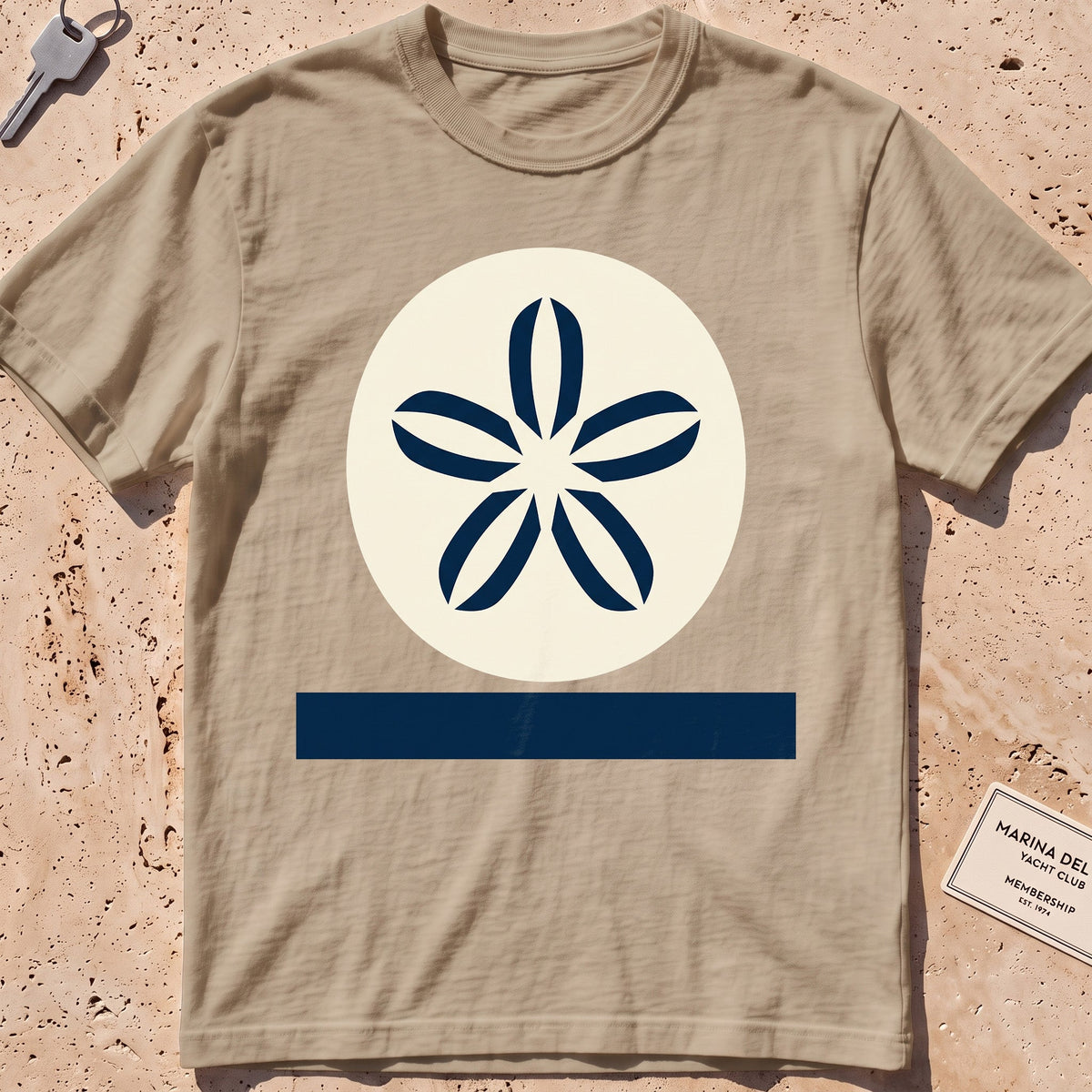 khaki heavyweight tee with a flat-geometric sand dollar graphic.