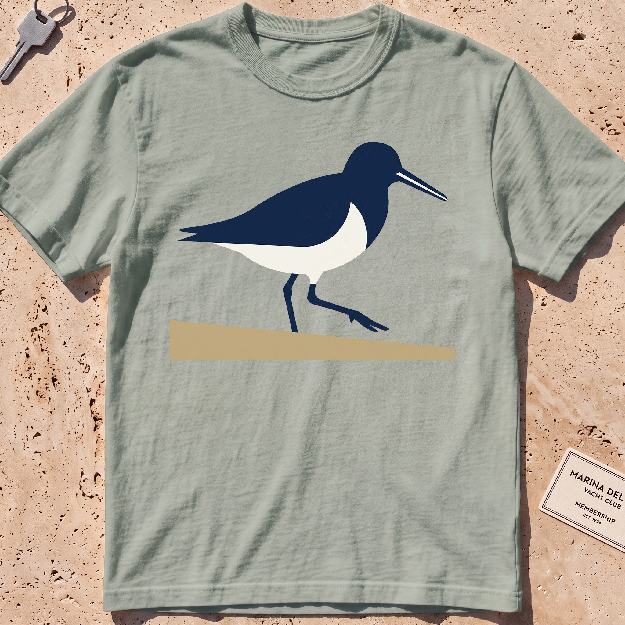 bay heavyweight tee with a flat-geometric sandpiper graphic.