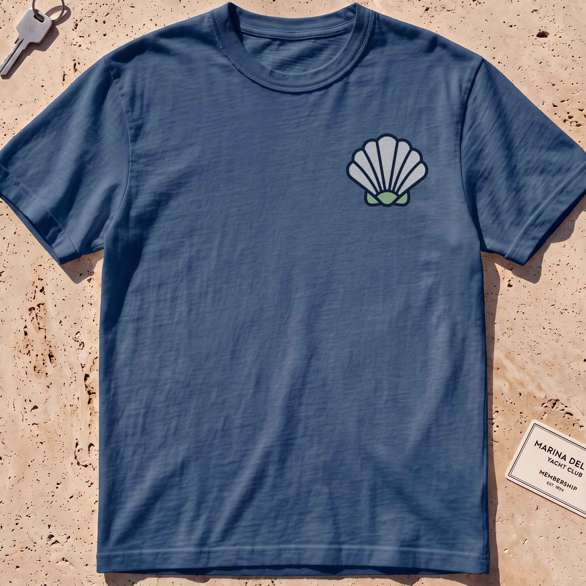 midnight heavyweight tee with a bold scallop shell graphic.