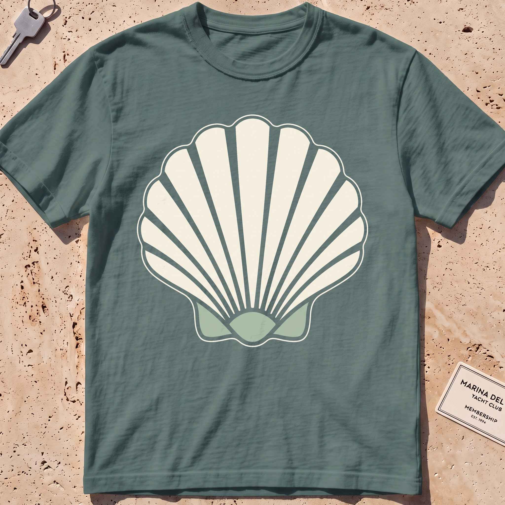 blue spruce heavyweight tee with a bold scallop shell graphic.