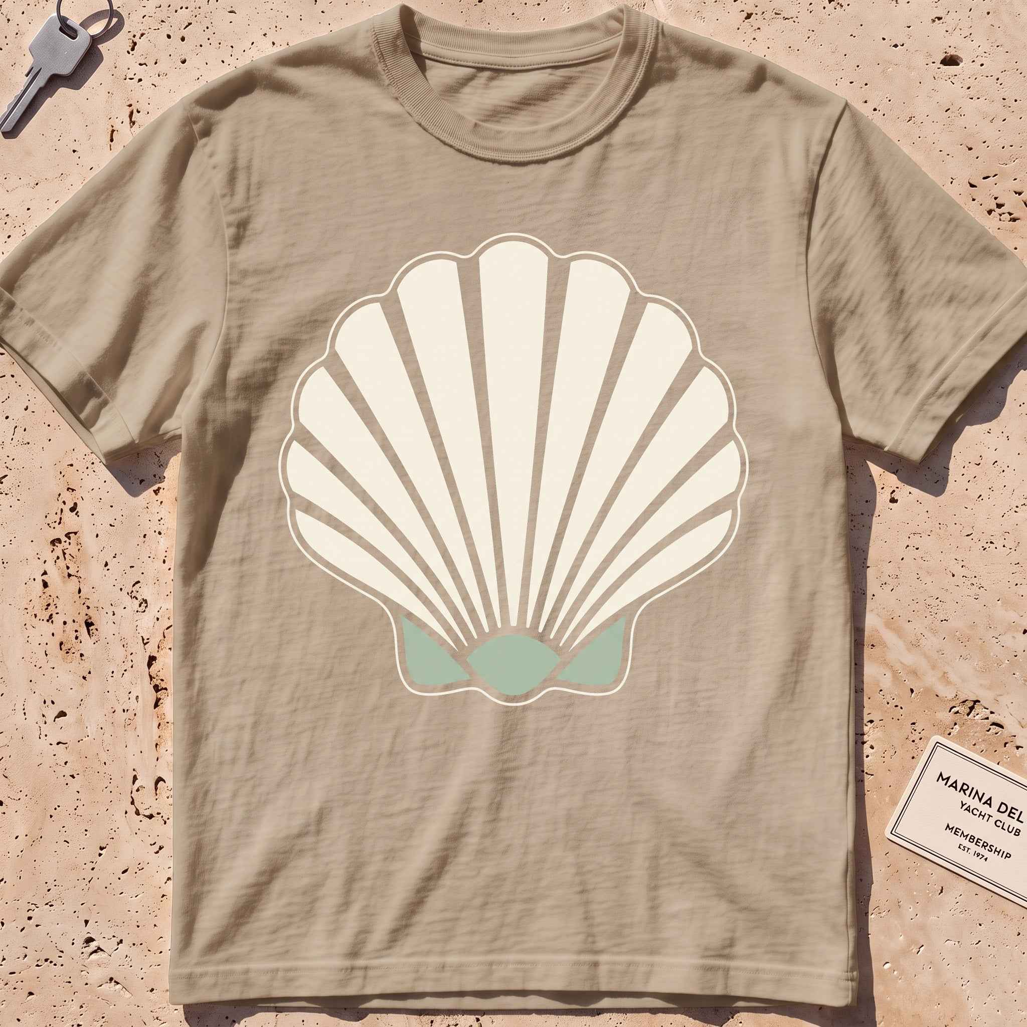 khaki heavyweight tee with a bold scallop shell graphic.