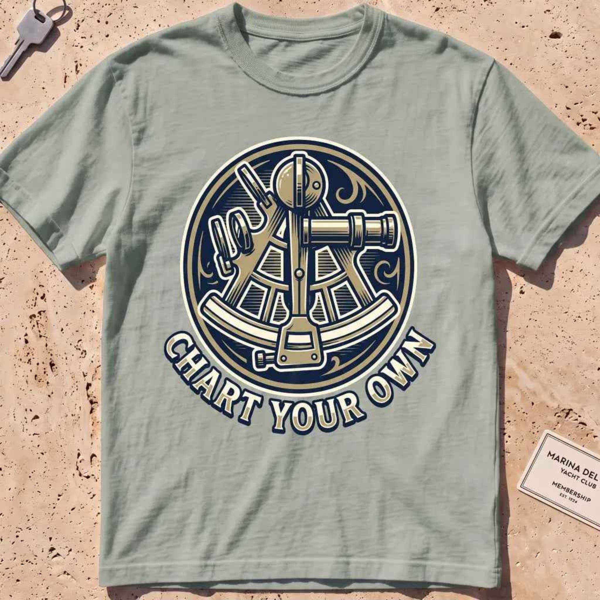 bay heavyweight tee with an engraved sextant "Chart Your Own" badge.