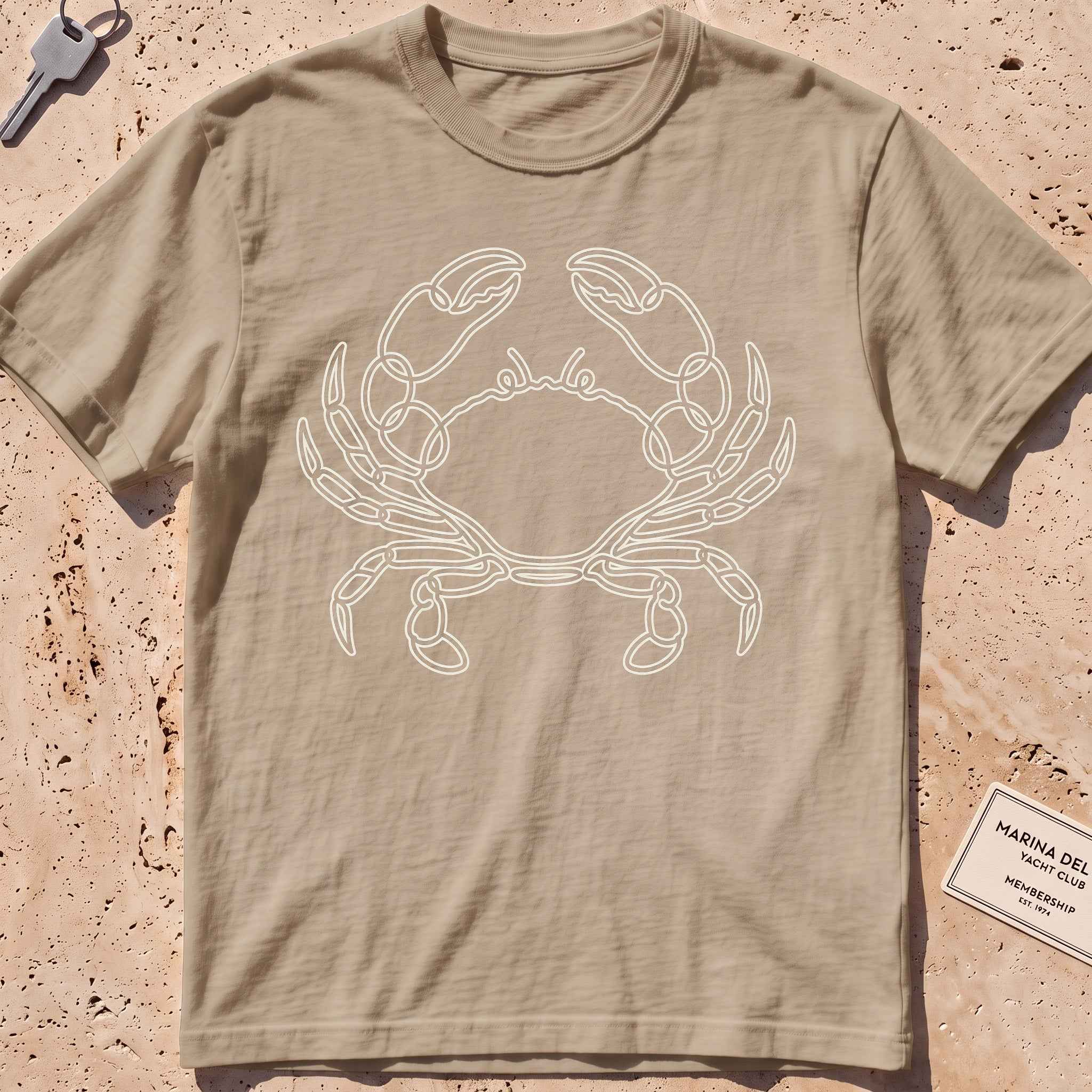 khaki heavyweight tee with a single-line sidestepping crab graphic.