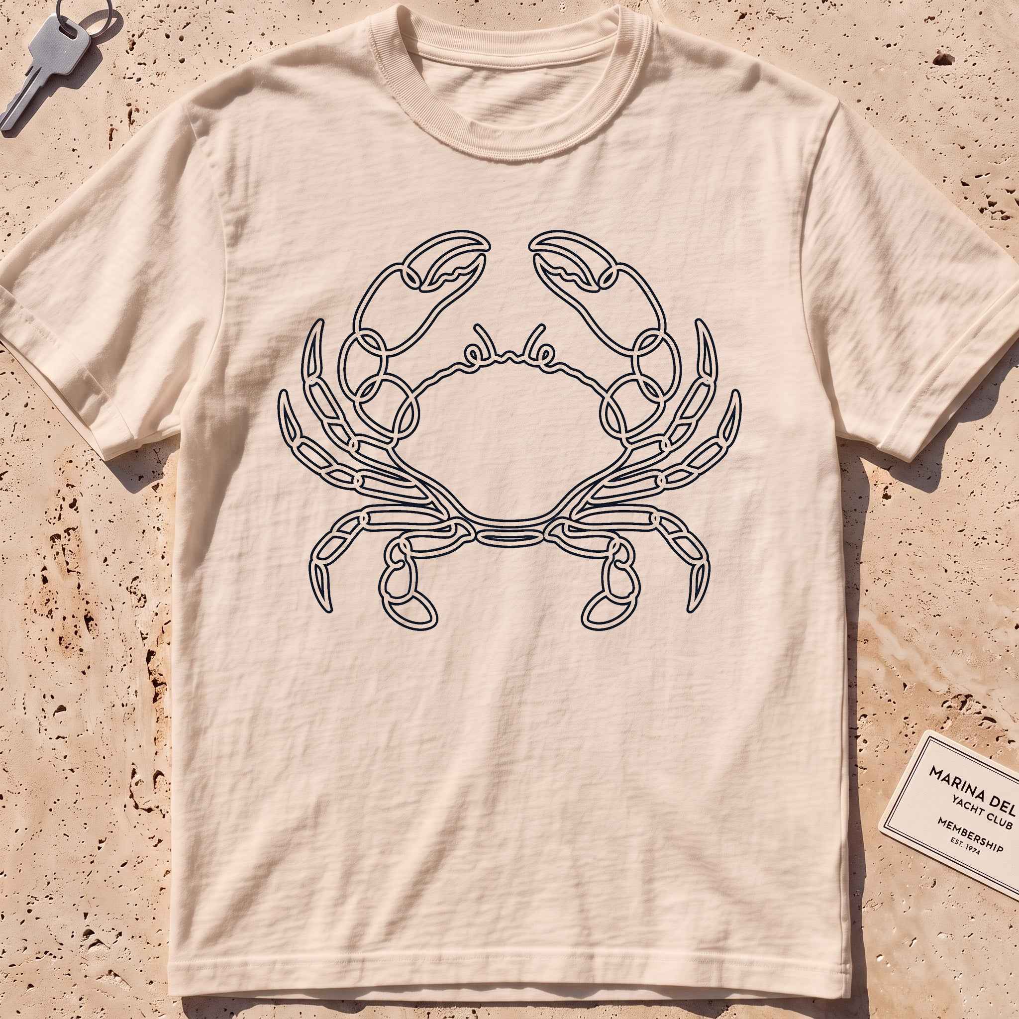 ivory heavyweight tee with a single-line sidestepping crab graphic.