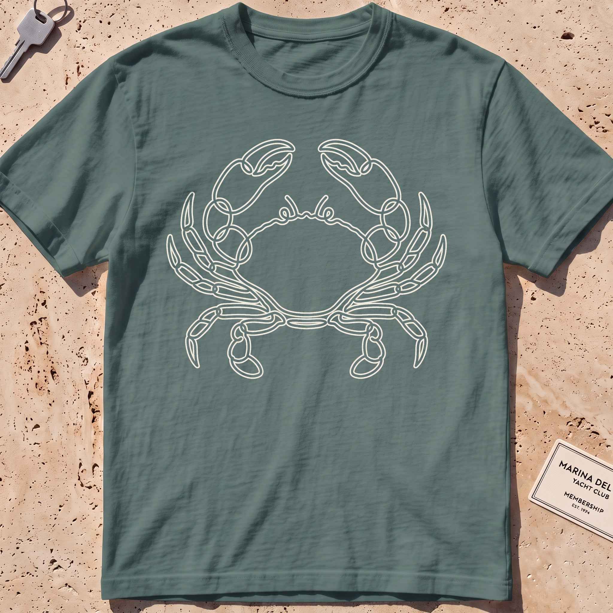 blue spruce heavyweight tee with a single-line sidestepping crab graphic.