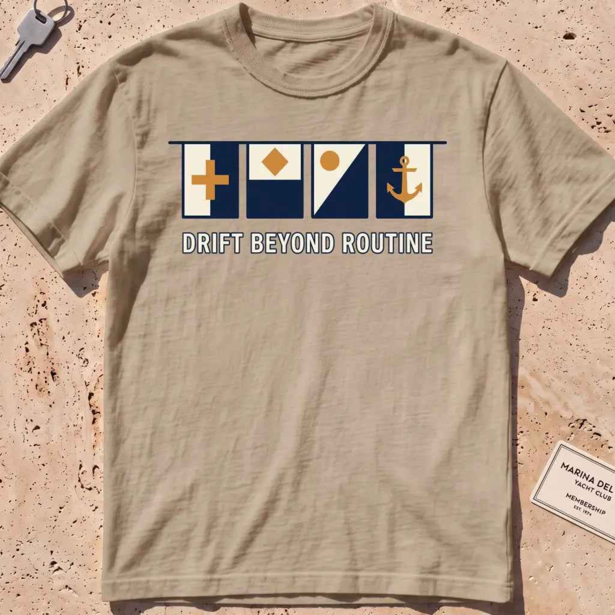 khaki heavyweight tee with maritime signal flags and "Drift Beyond Routine" text.