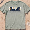 bay heavyweight tee with maritime signal flags and "Drift Beyond Routine" text.