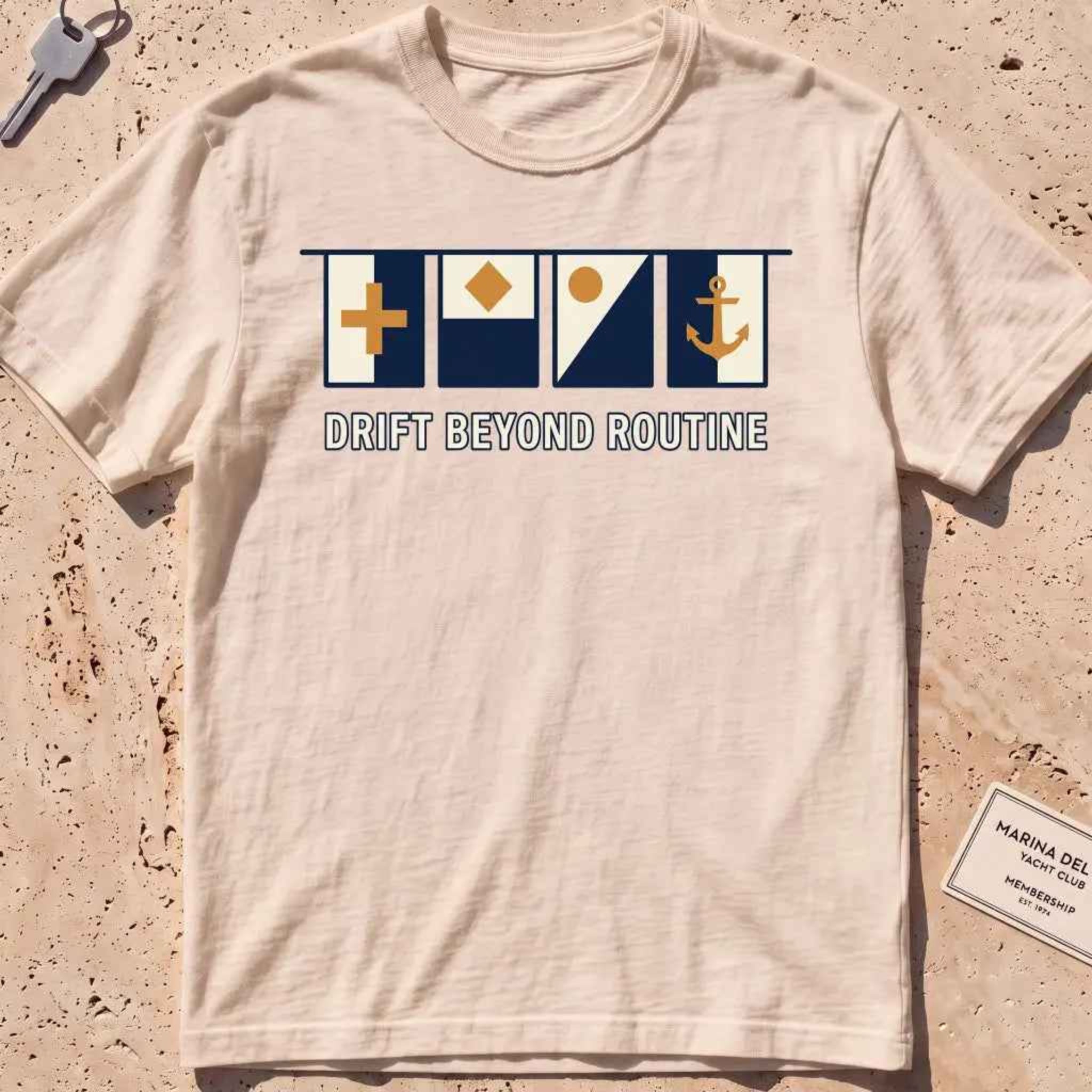 ivory heavyweight tee with maritime signal flags and "Drift Beyond Routine" text.