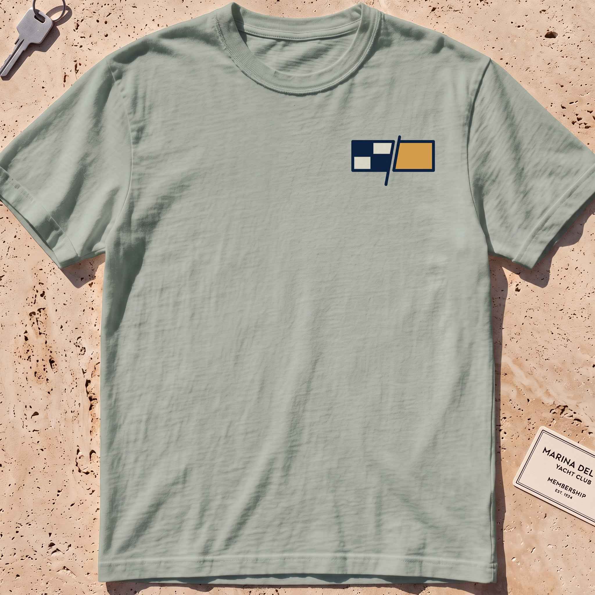 bay heavyweight tee with a pair of maritime signal flags crest graphic.